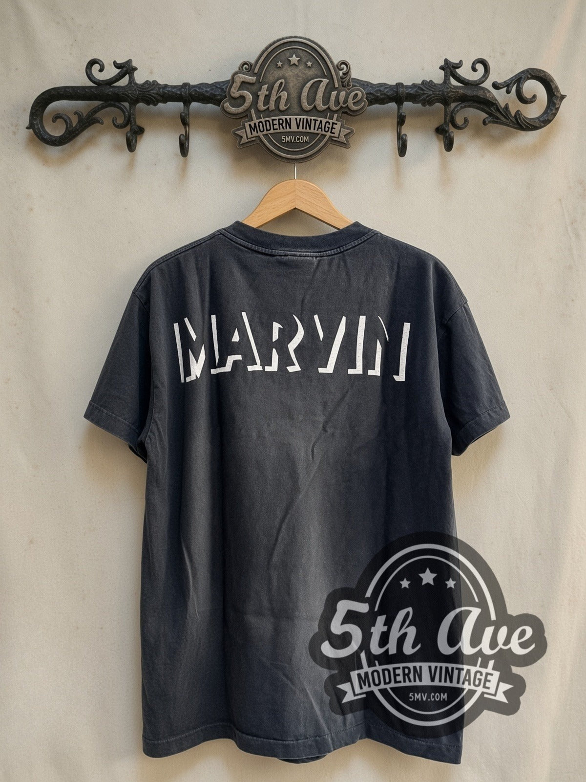 Looney Tunes Marvin the Martian vintage cartoon tee in black, back view on a display rack