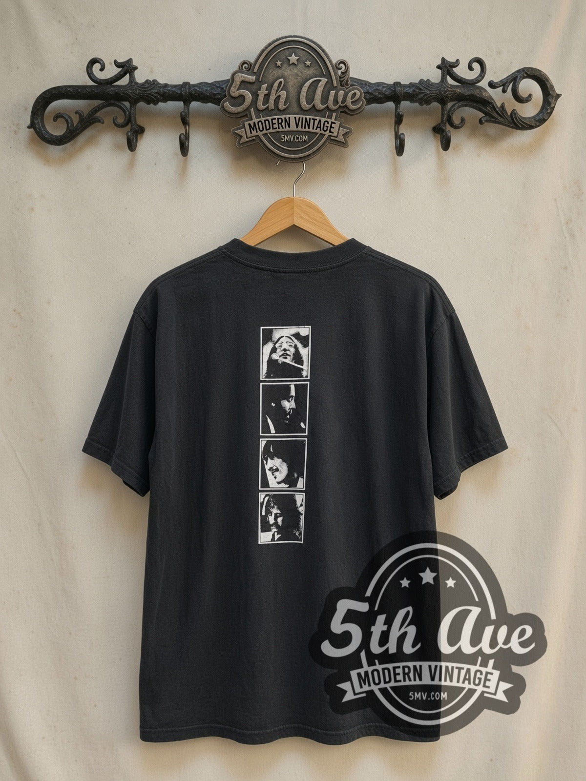 The Beatles Let It Be 1970 vintage band t-shirt in black, back view on a display rack