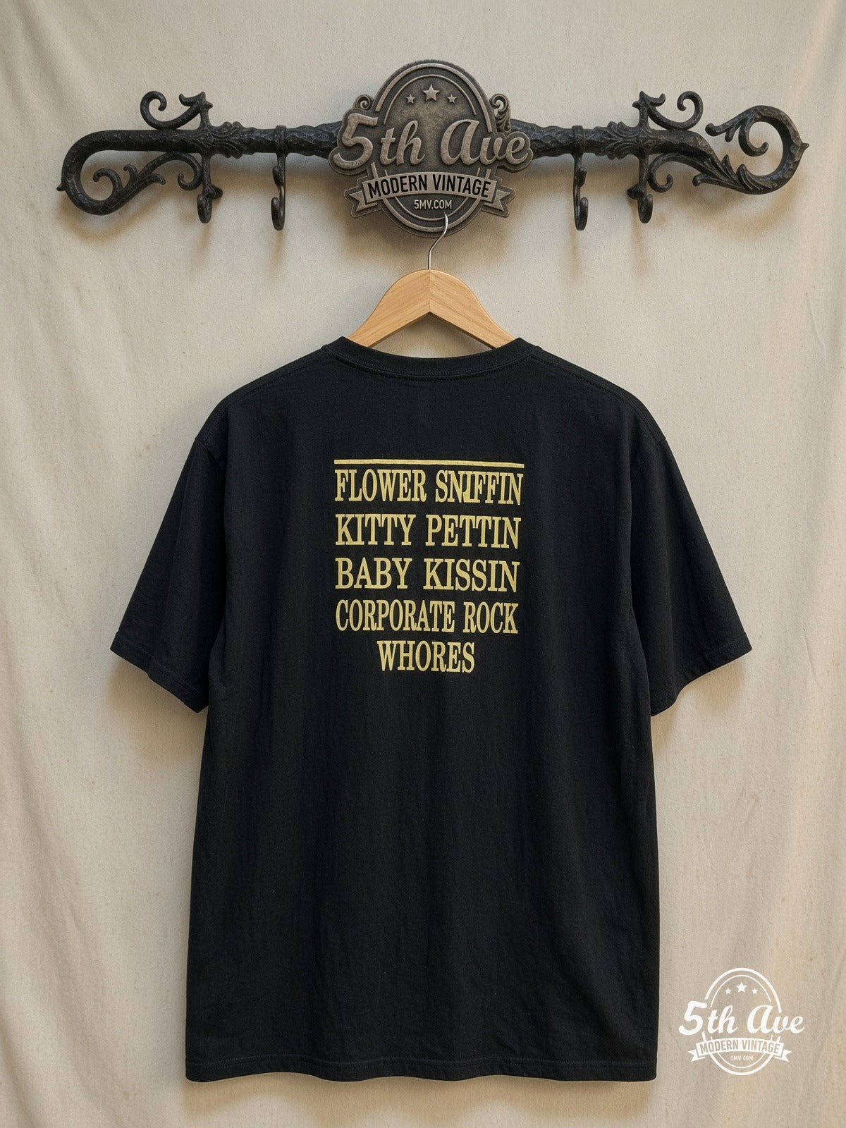 Nirvana – Classic Yellow Smiley Face Logo – Vintage Band T-Shirt — back on locked cream ornate 5th Ave rack