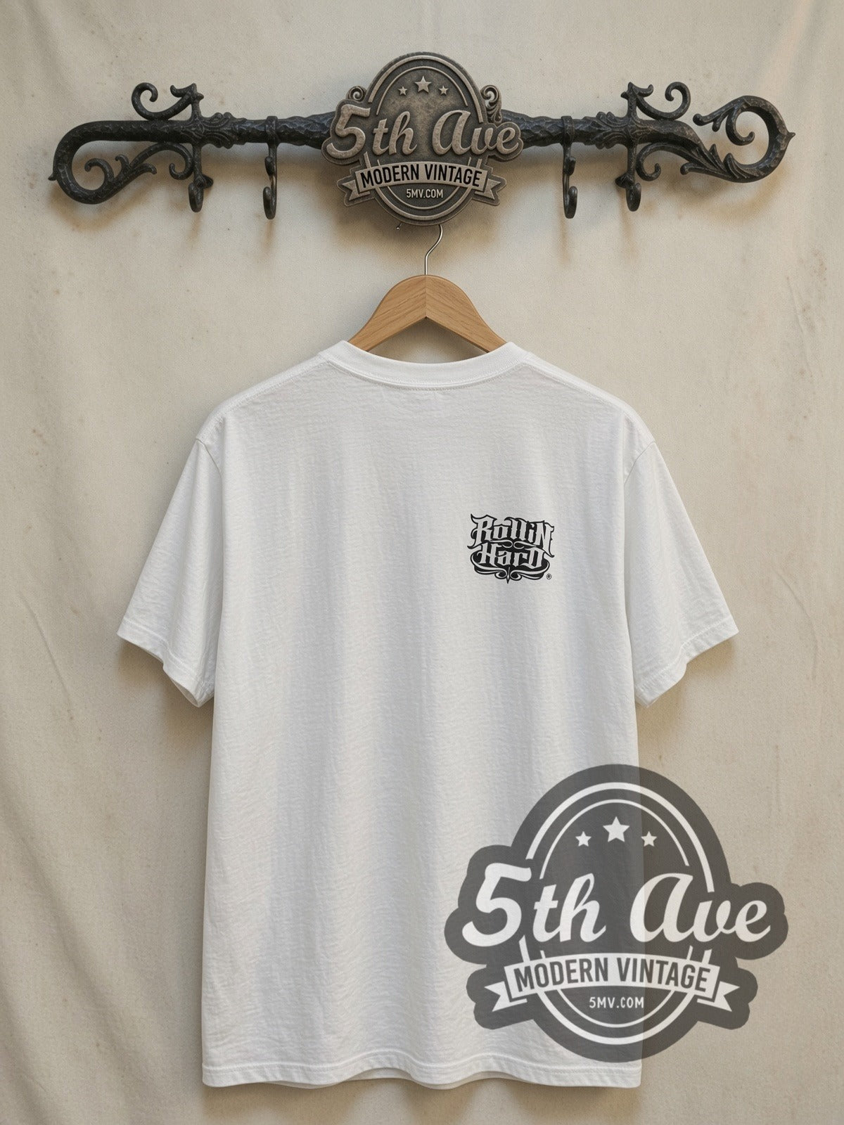 Rollin Hard Can Ya Feel Me? Lowrider vintage graphic tee, back view on a display rack