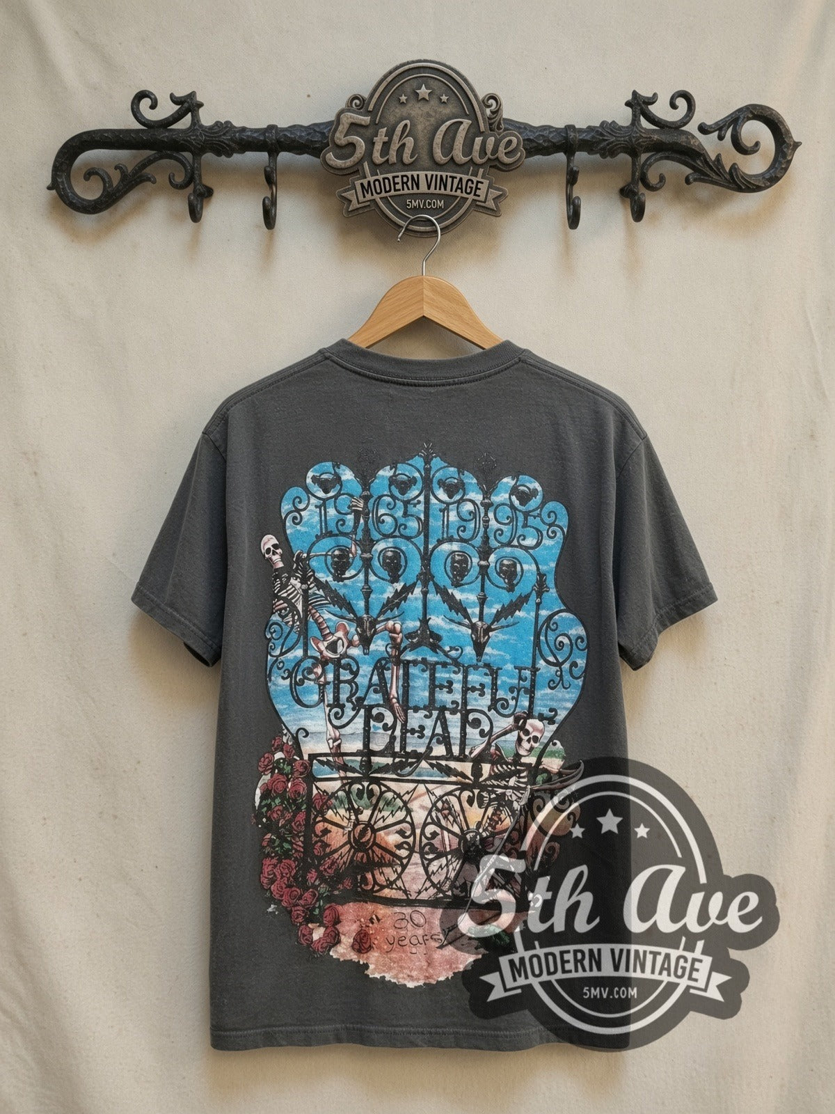 Grateful Dead 30 Year Tribute vintage band t-shirt, back view on a display rack