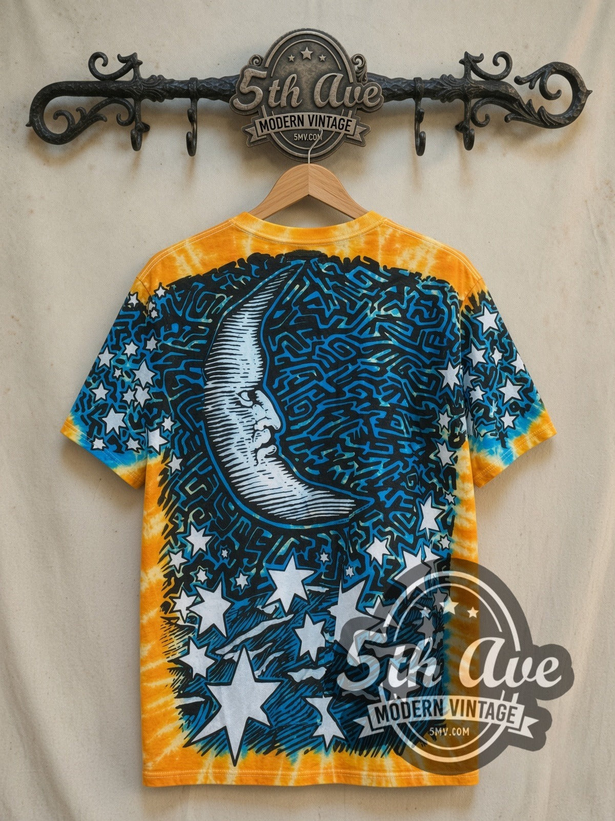 Sun and Moon Tie-Dye Sun and Moon all-over-print graphic tee, back view on a display rack