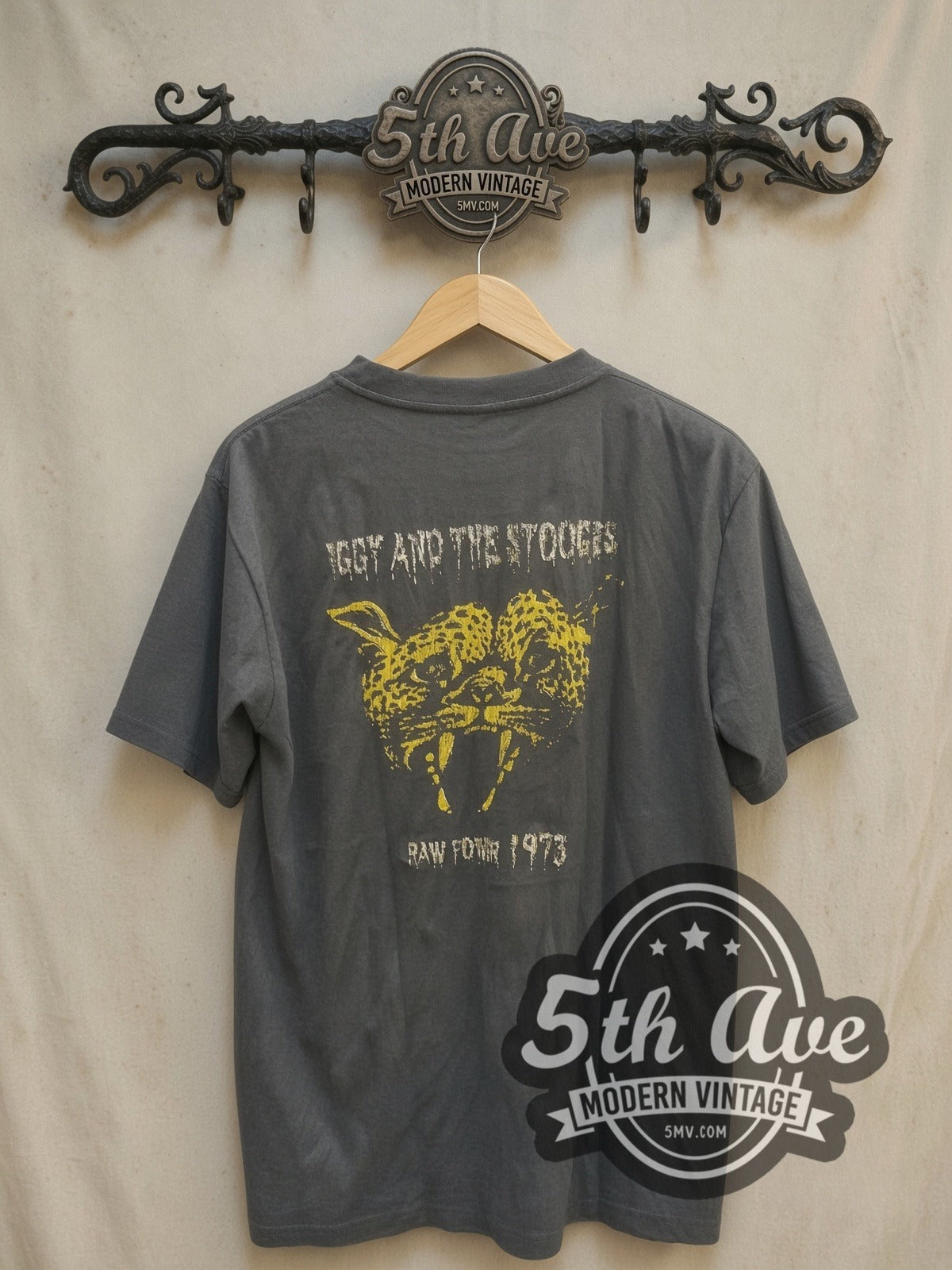 Iggy and The Stooges Raw Power 1973 vintage band t-shirt, back view on a display rack