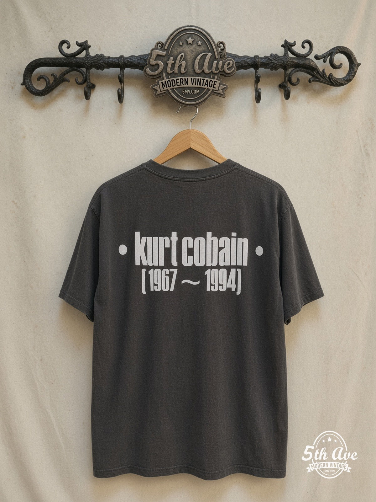 Kurt Cobain – Memorial – Vintage Band T-Shirt — back on locked cream ornate 5th Ave rack