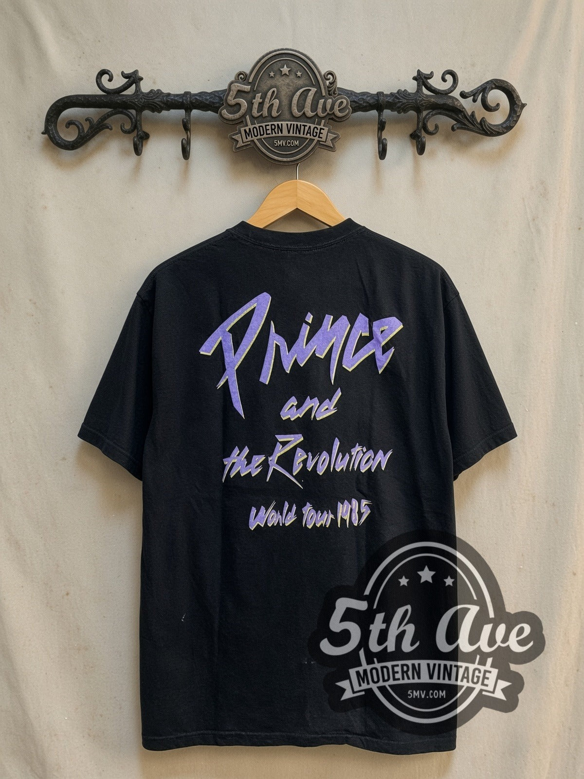 Prince and the Revolution vintage band t-shirt, back view on a display rack