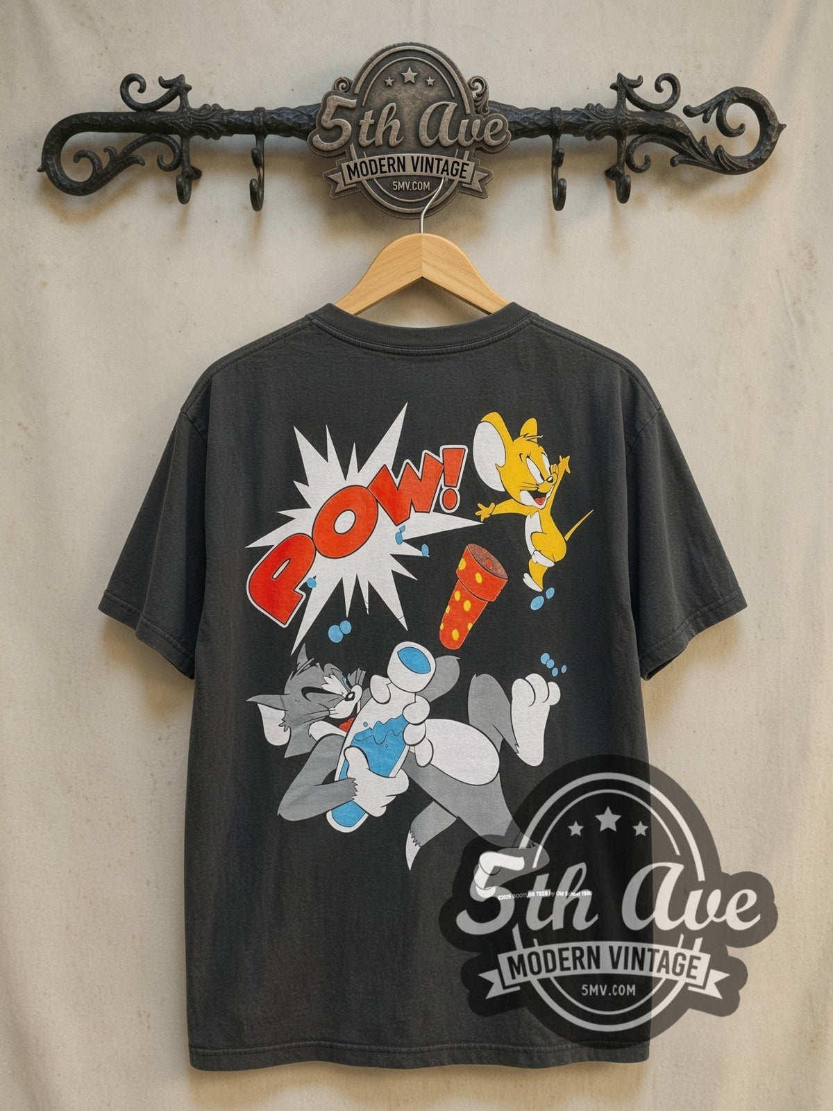 Tom and Jerry vintage cartoon tee, back view on a display rack