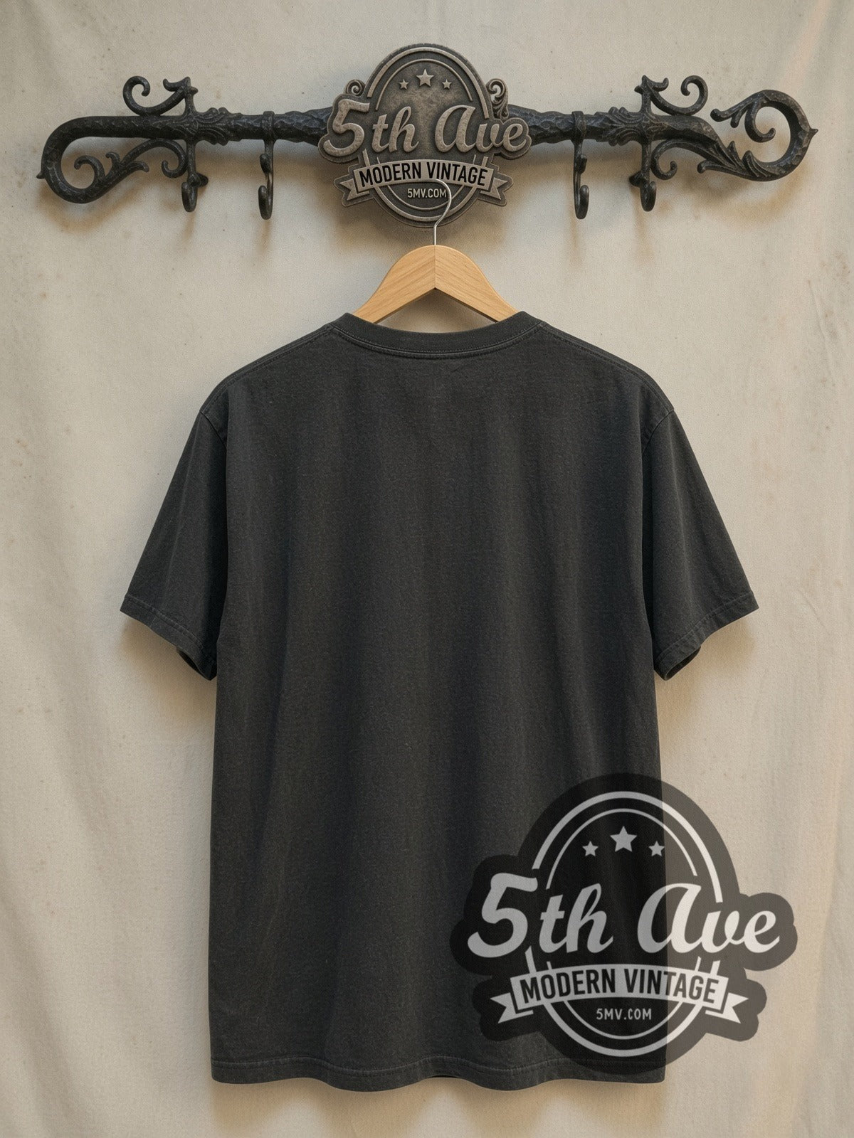The Beatles Abbey Road Crossing Cyan Logo vintage band t-shirt, back view on a display rack