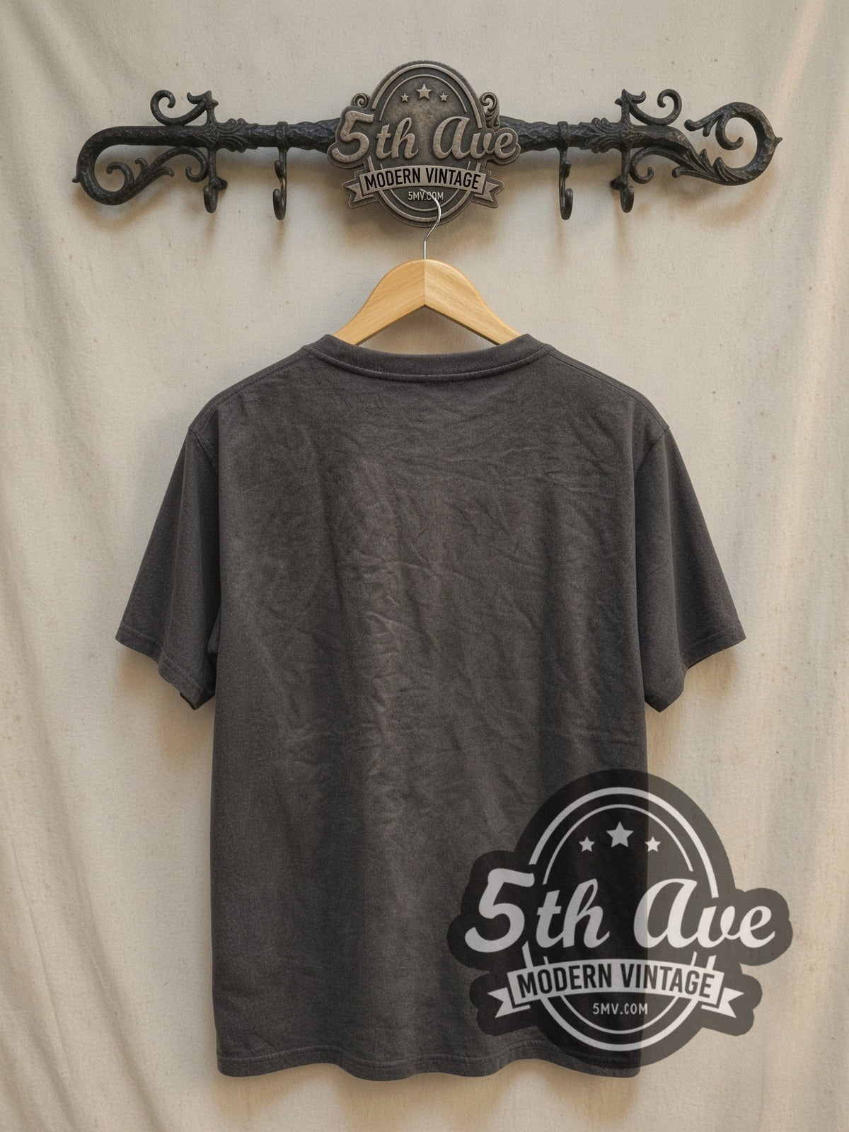 Oasis Bulls Legends vintage band t-shirt, back view on a display rack