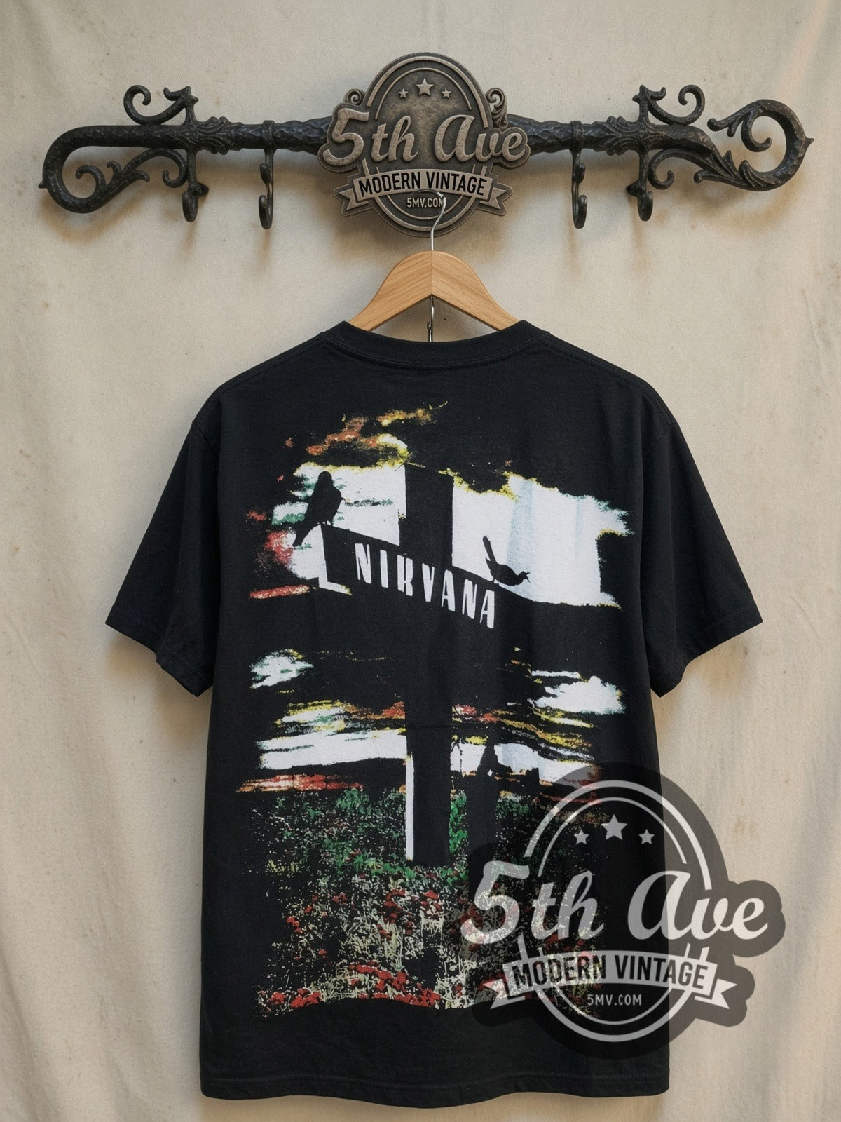Kurt Cobain Who Killed Kurt Cobain vintage band t-shirt, back view on a display rack