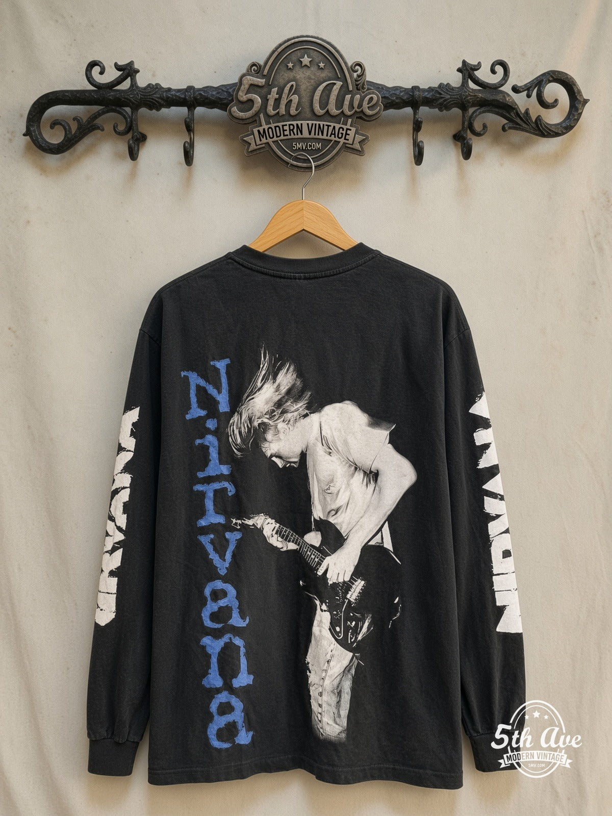 Nirvana – Kurt Cobain Blue Logo Play Electric Guitar Long Sleeve – Vintage Band T-Shirt — back on locked cream ornate 5th Ave rack