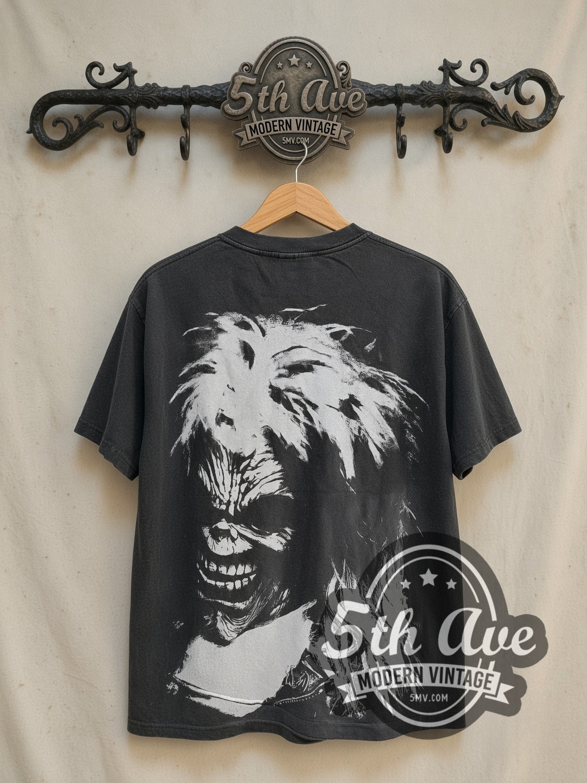 Iron Maiden Brave New World Tour all-over-print vintage band t-shirt in black, back view on a display rack