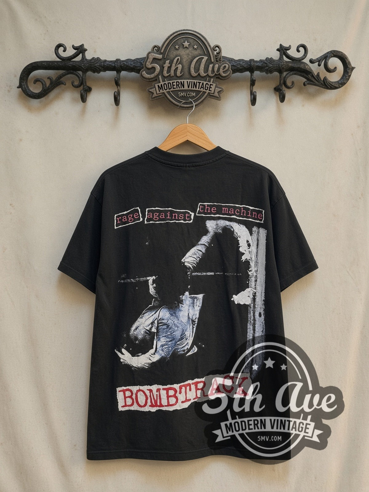 Rage Against the Machine Bombtrack Red Blue all-over-print vintage band t-shirt in black, back view on a display rack