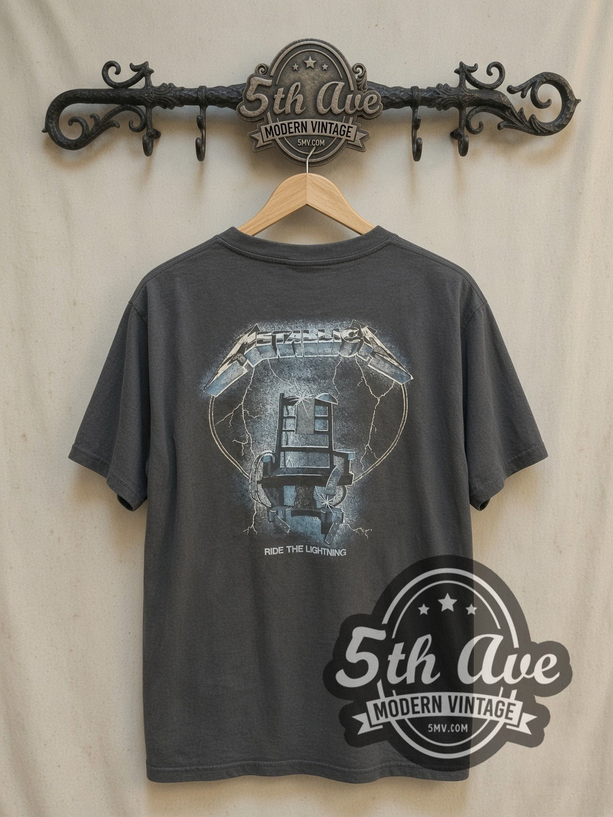 Metallica Ride the Lightning' Monster Beast and Electric Chair Cotton vintage band t-shirt, back view on a display rack