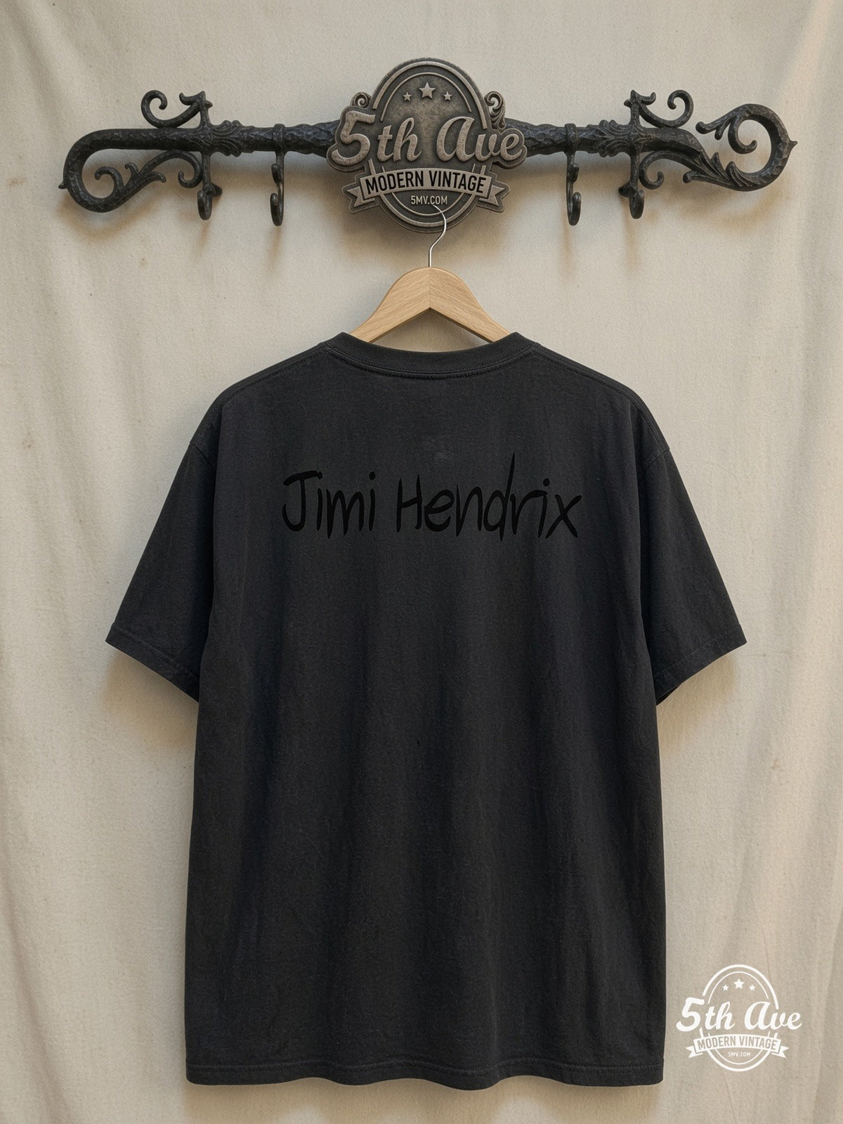 Jimi Hendrix – Multi Photo Collage Red Script – Vintage Band T-Shirt — back on locked cream ornate 5th Ave rack