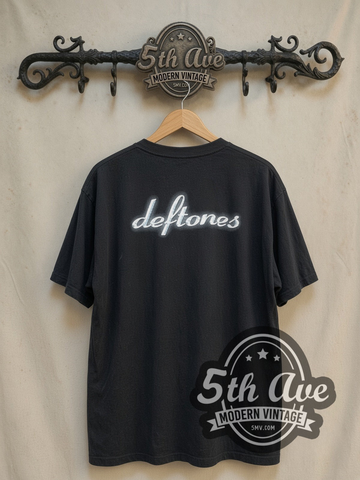 Deftones vintage band t-shirt, back view on a display rack