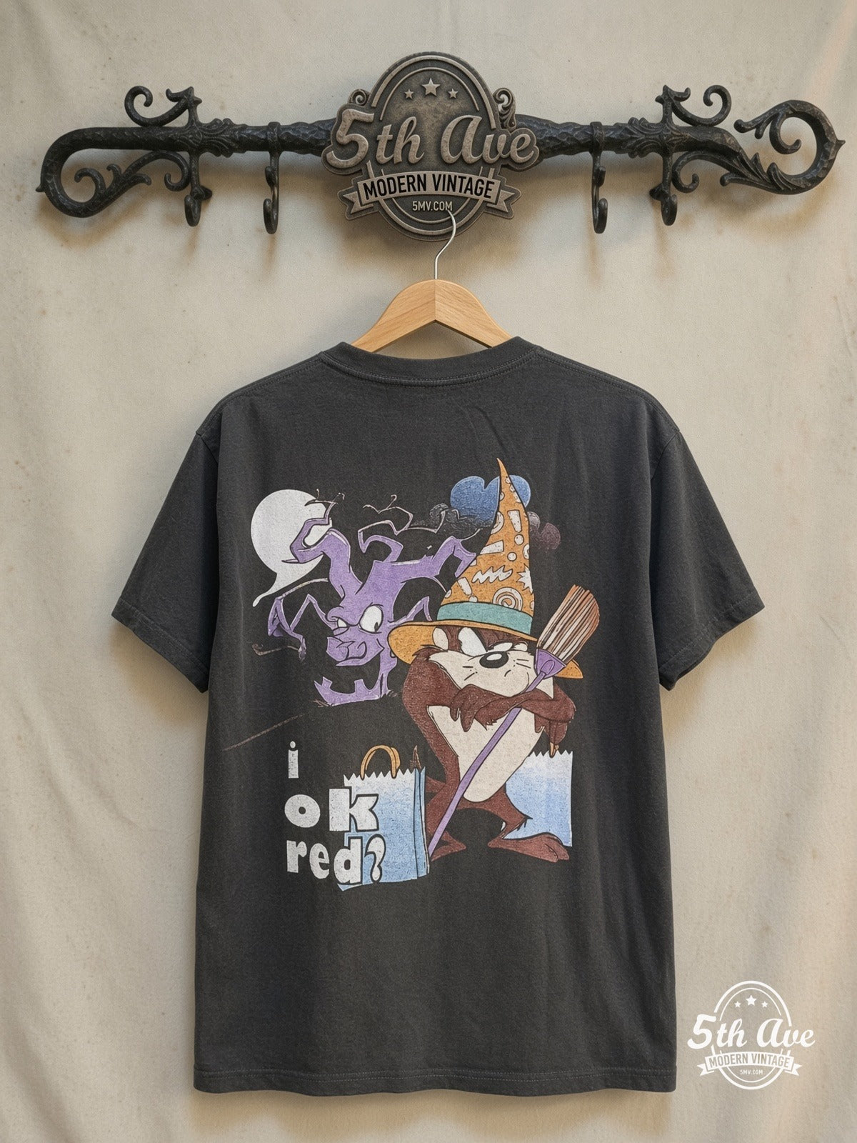 Looney Tunes Taz-Mania The More Candy I Eat vintage cartoon tee in black, back view on a display rack