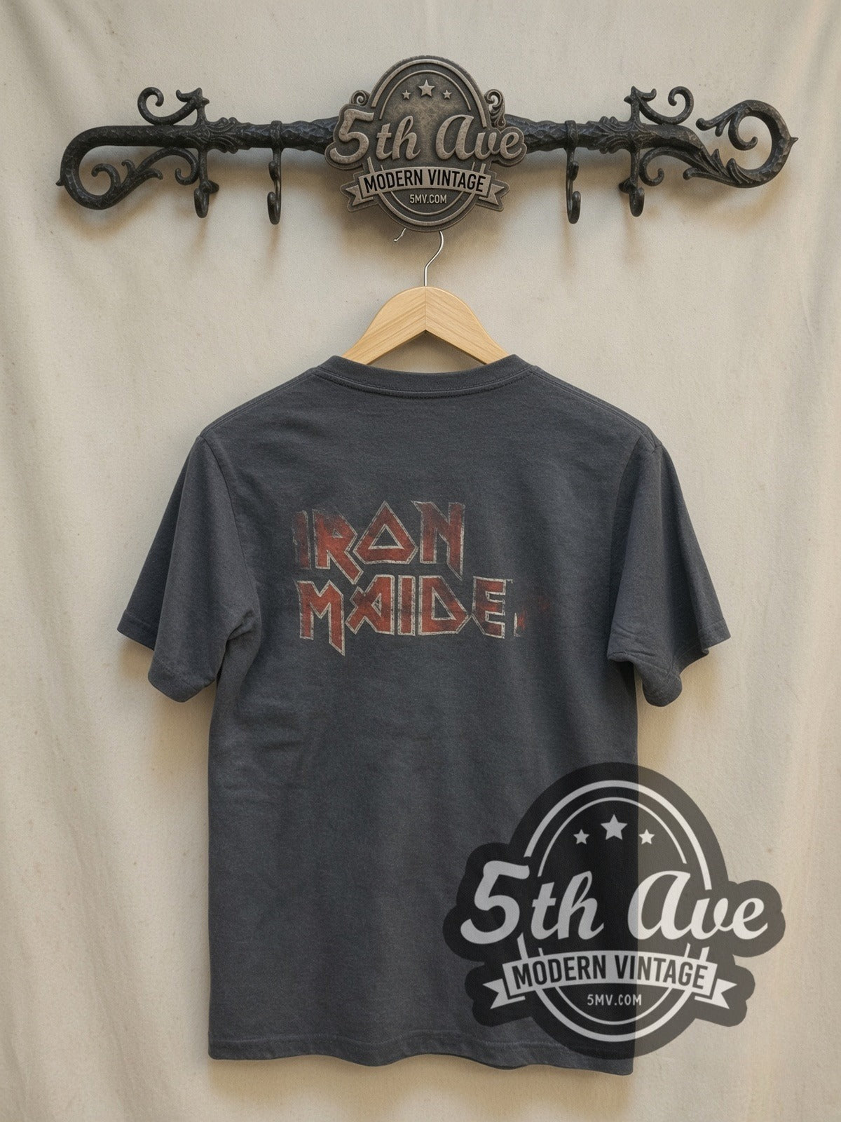 Iron Maiden The Number of the Beast vintage band t-shirt, back view on a display rack