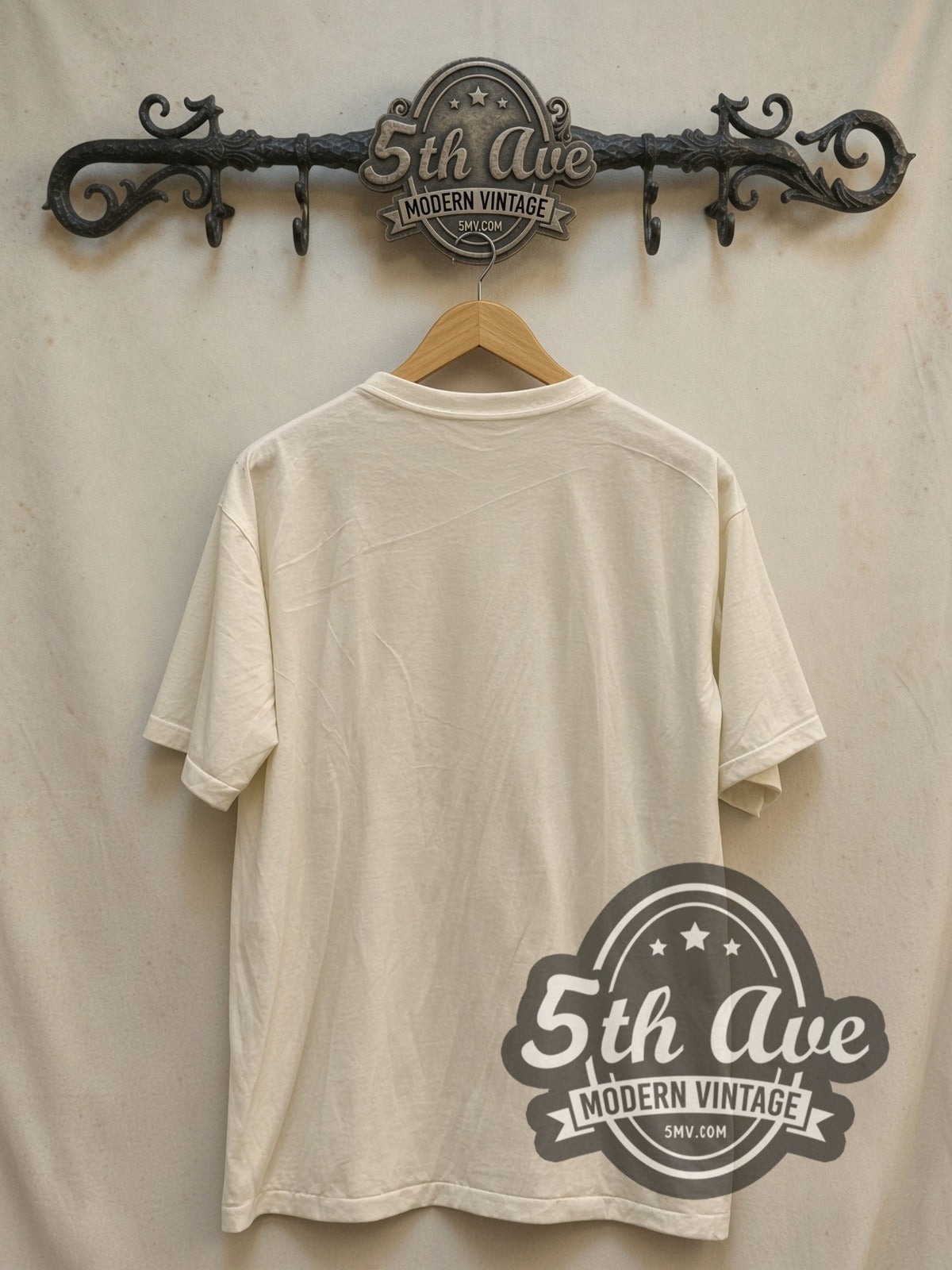 Elton John 1974 Tour Concert vintage band t-shirt, back view on a display rack