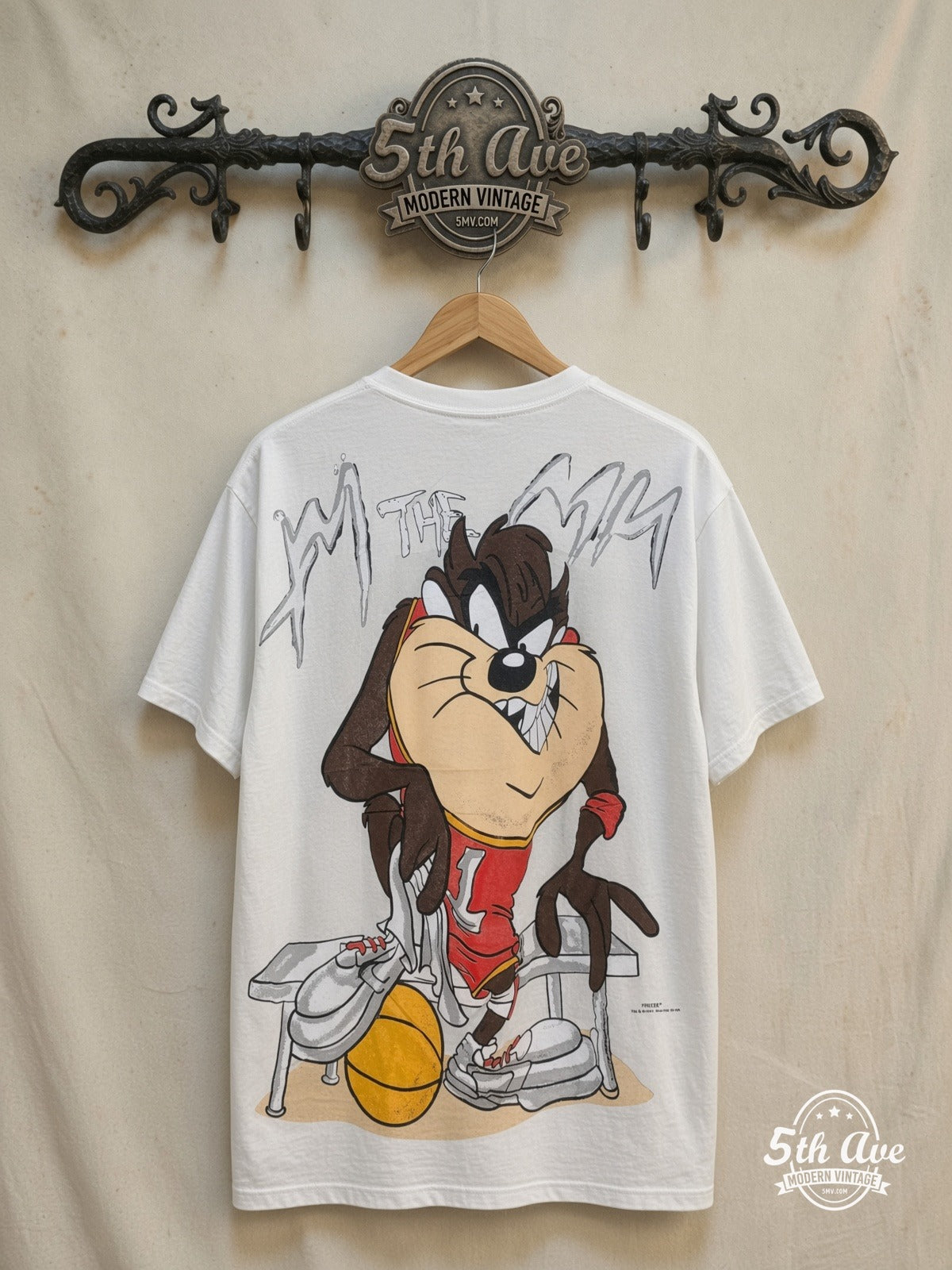 Looney Tunes – Taz-Mania Bold Print – All Over Print – New Vintage Graphic Tee — back on locked cream ornate 5th Ave rack