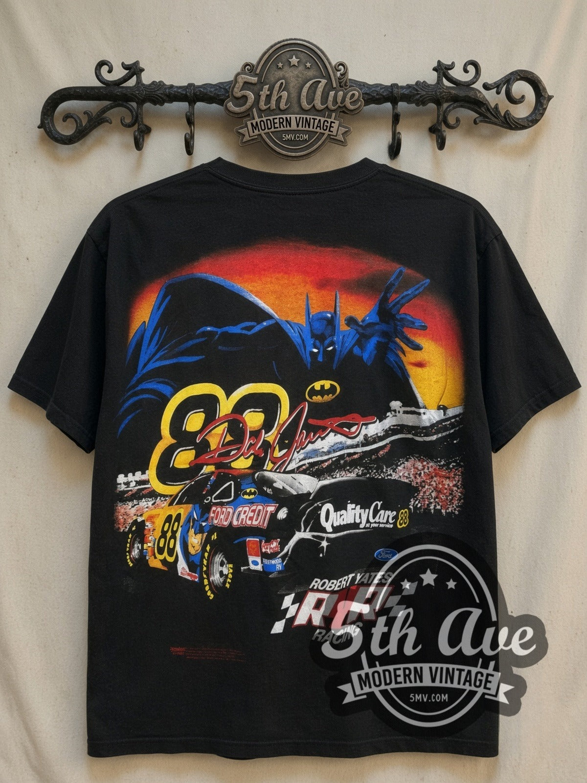 NASCAR Dale Jarrett Batman Ford Taurus Black all-over-print vintage graphic t-shirt, back view on a display rack
