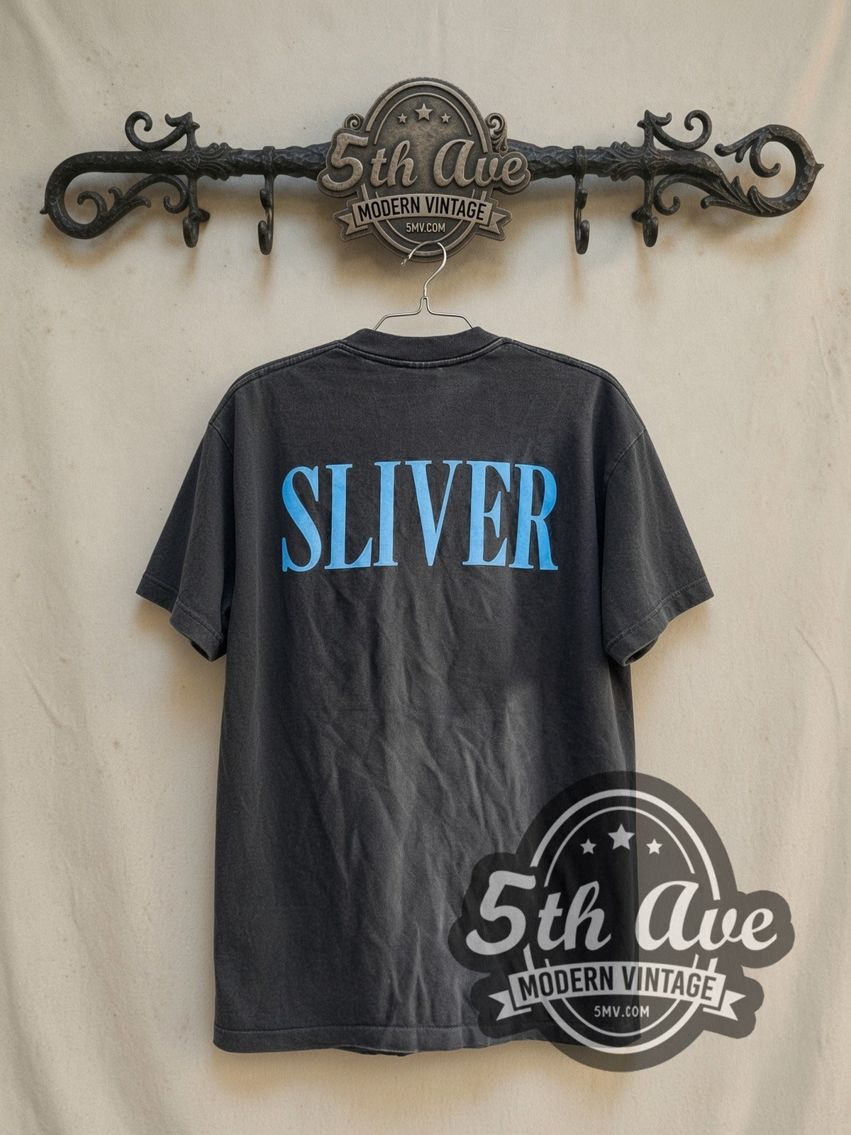 Nirvana Sliver Anatomical Figure Charcoal vintage band t-shirt, back view on a display rack