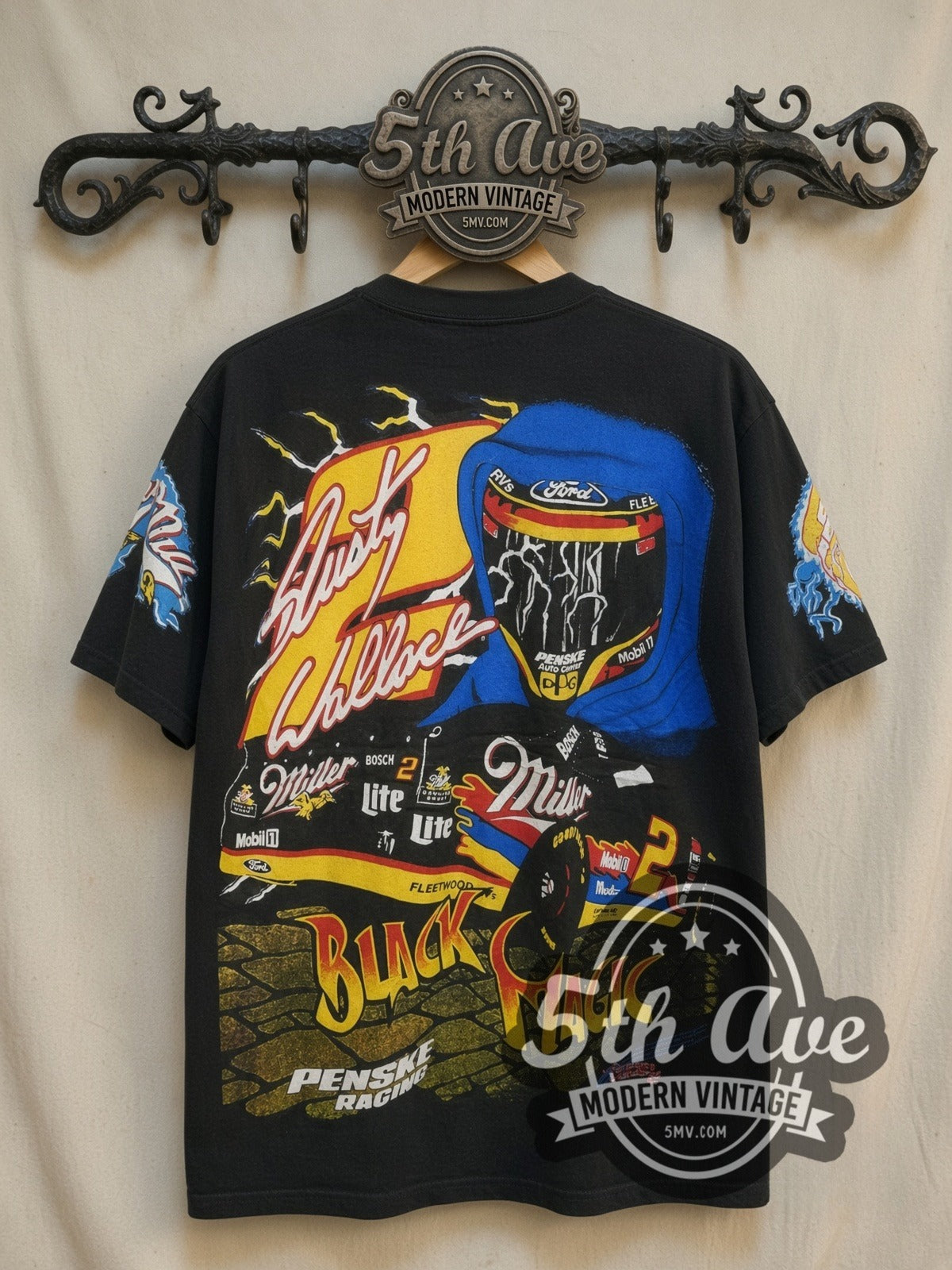 NASCAR Rusty Wallace Black Magic Miller #2 Black all-over-print vintage graphic t-shirt, back view on a display rack