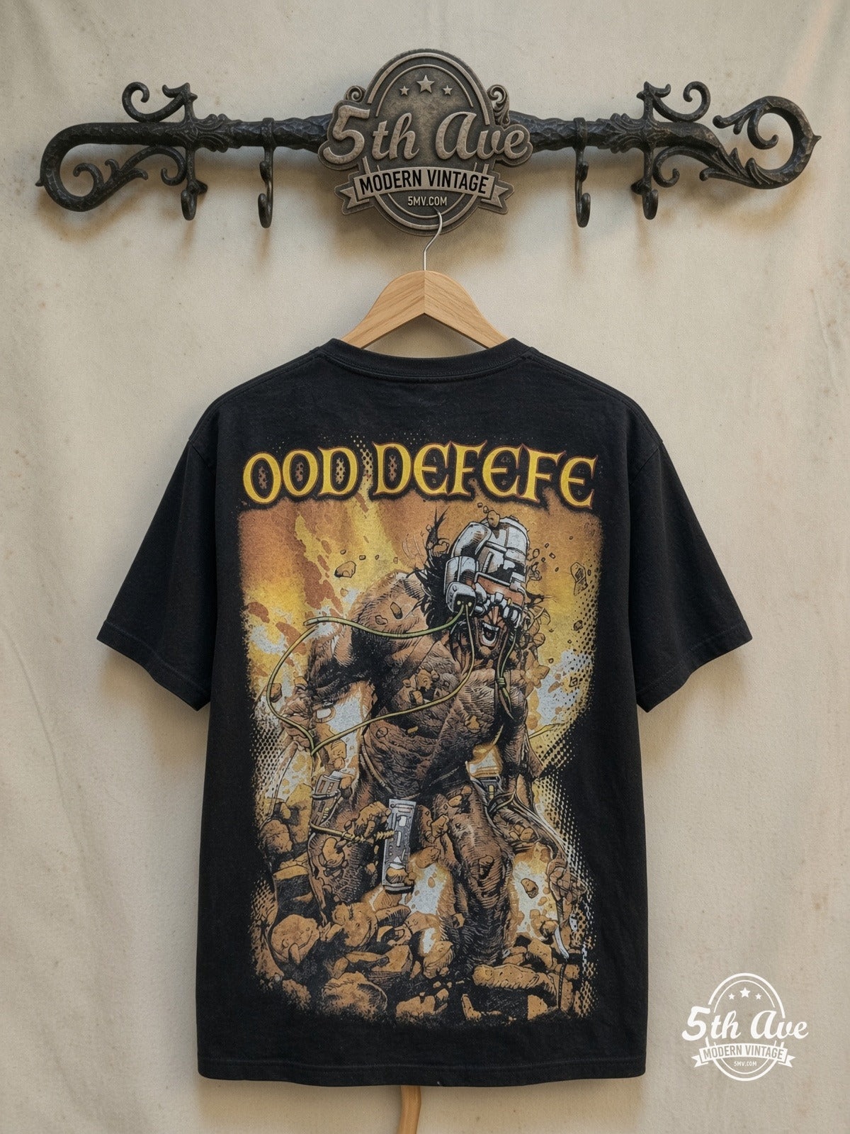 Wolverine – Overprint – Vintage Movie Tee — back on locked cream ornate 5th Ave rack