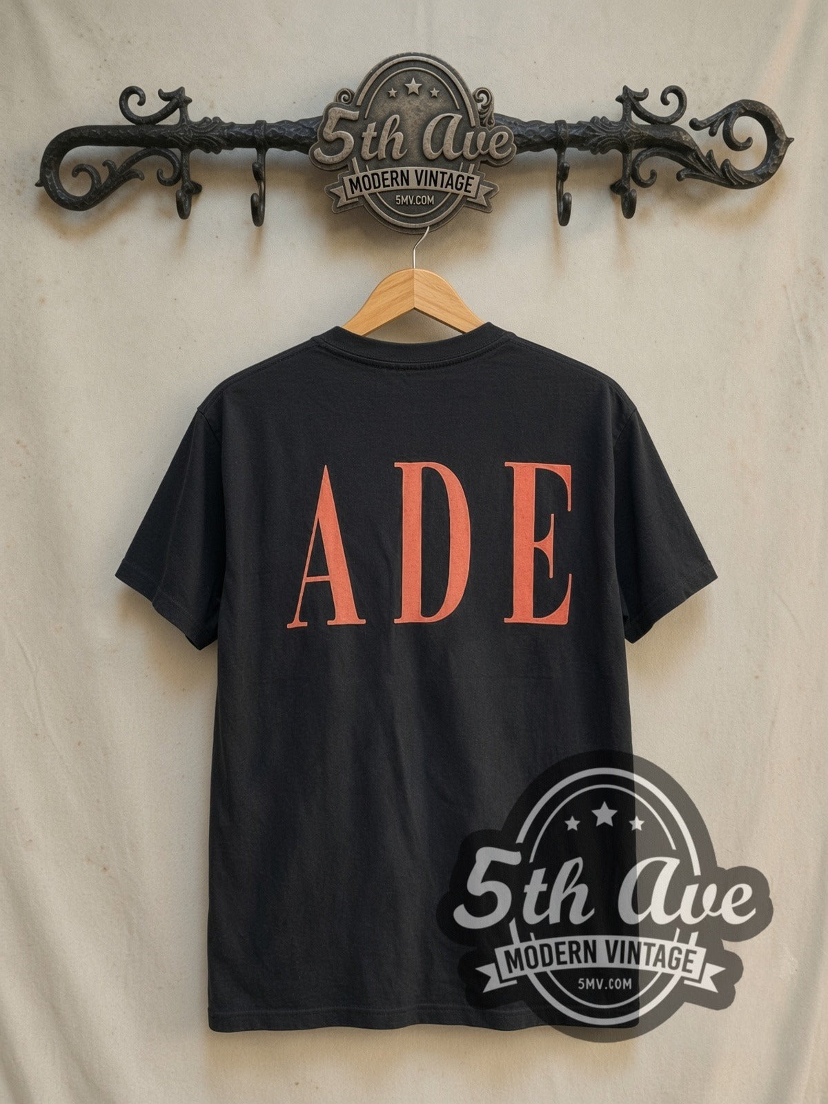Sade Queen of Cool Crossed Arms Denim vintage band t-shirt in black, back view on a display rack
