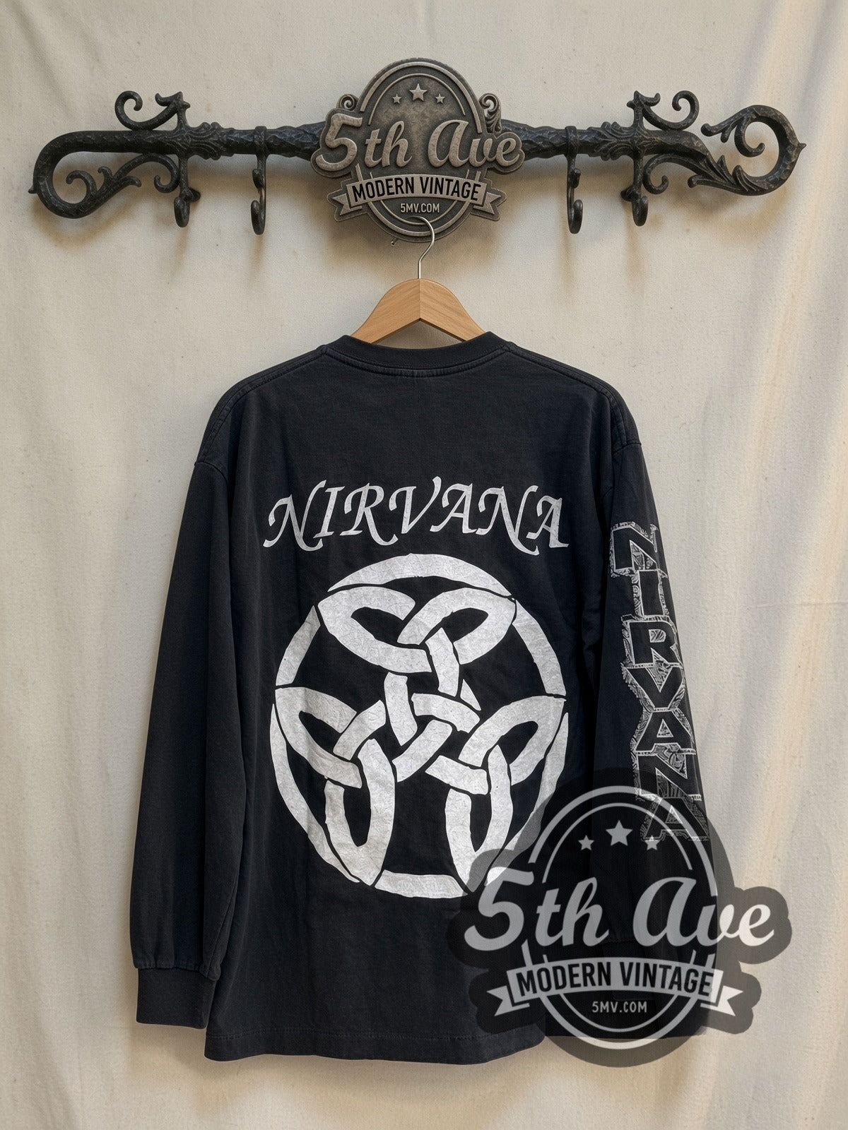 Nirvana 1987-1994 Band Portraits Long Sleeve vintage band t-shirt in black, back view on a display rack