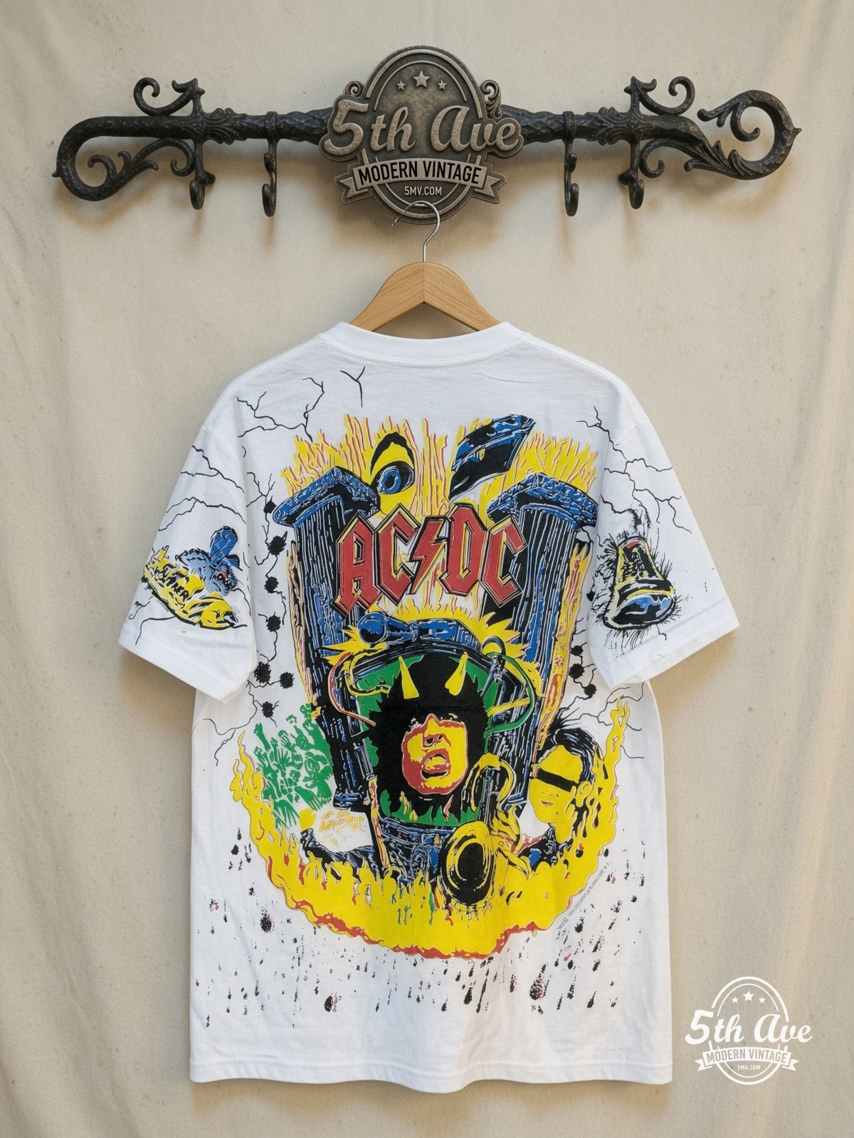 AC/DC – High Voltage Harmony – All Over Print – Vintage Band T-Shirt — back on locked cream ornate 5th Ave rack