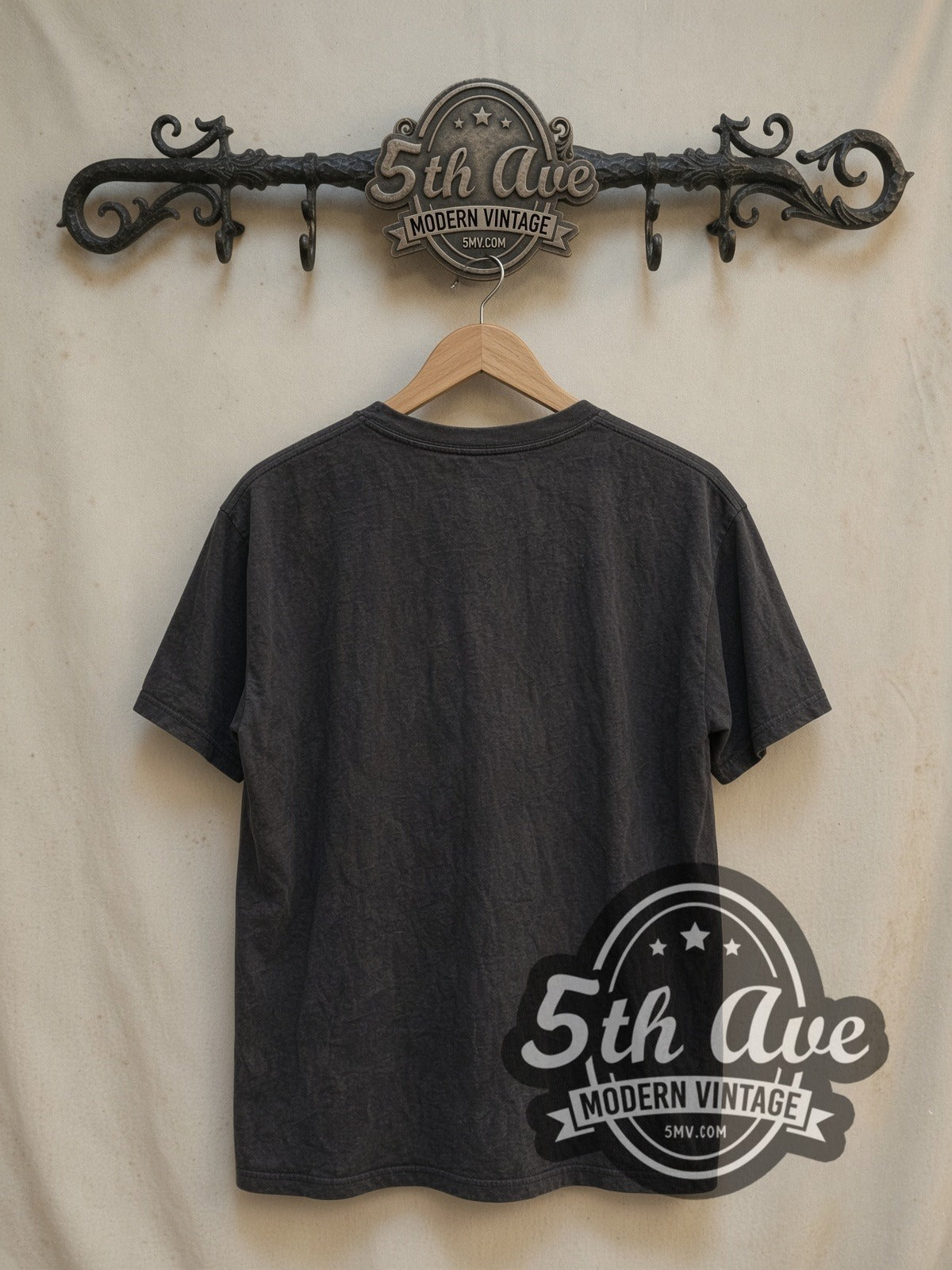 The Beatles Circle Logo Band Photo vintage band t-shirt, back view on a display rack