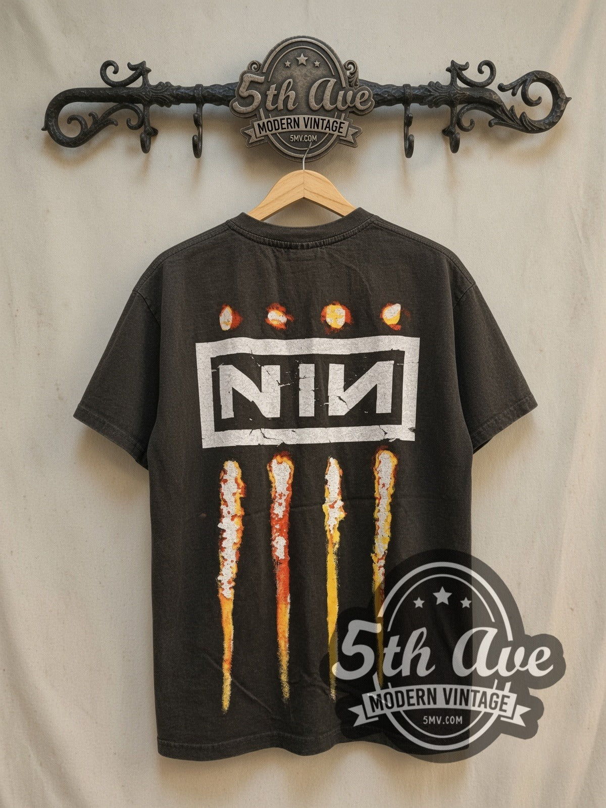 Nine Inch Nails Downward Spiral vintage band t-shirt, back view on a display rack