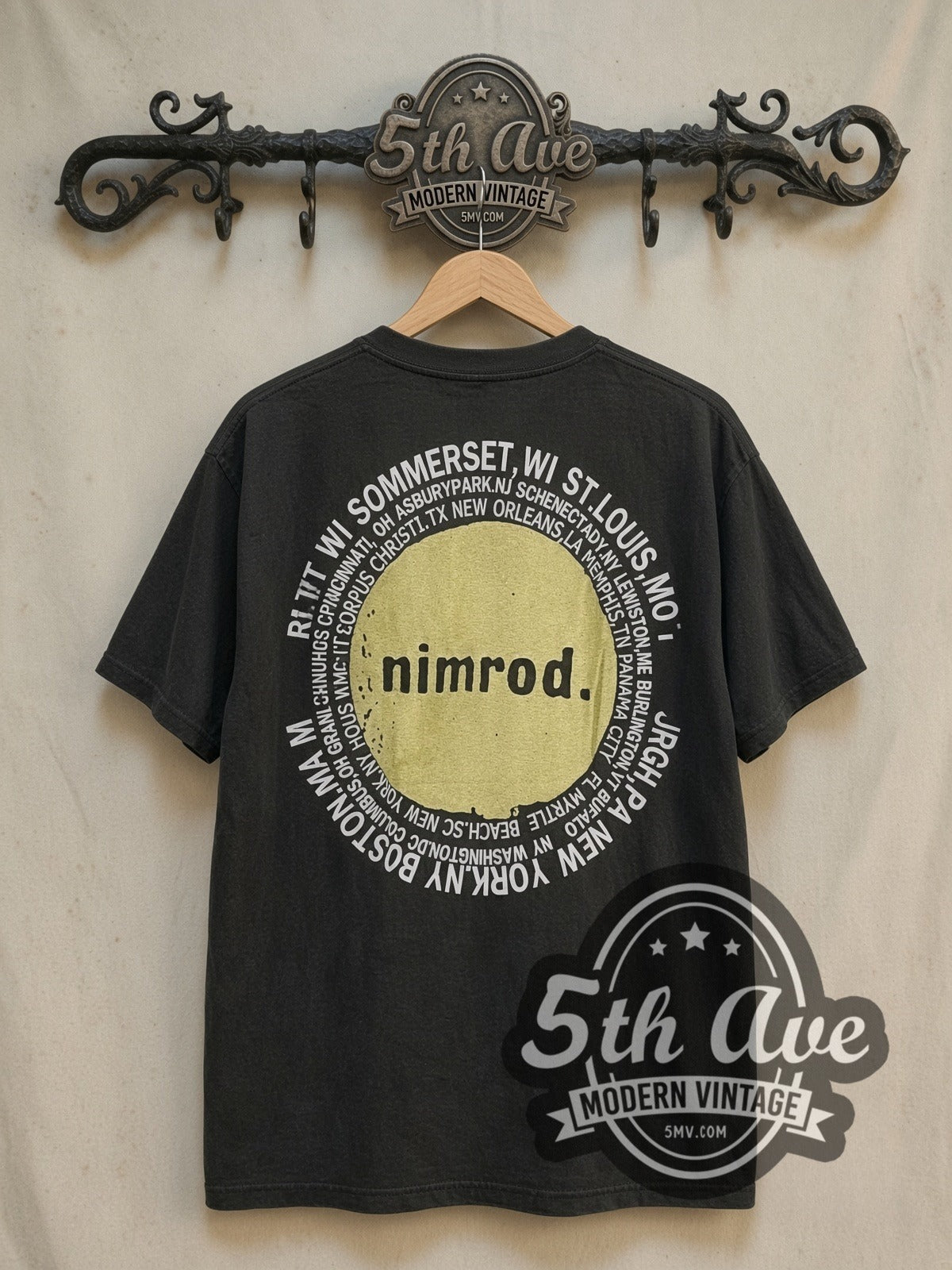 Green Day Nimrod Tour T-Shirt Classic Band Design vintage band t-shirt, back view on a display rack
