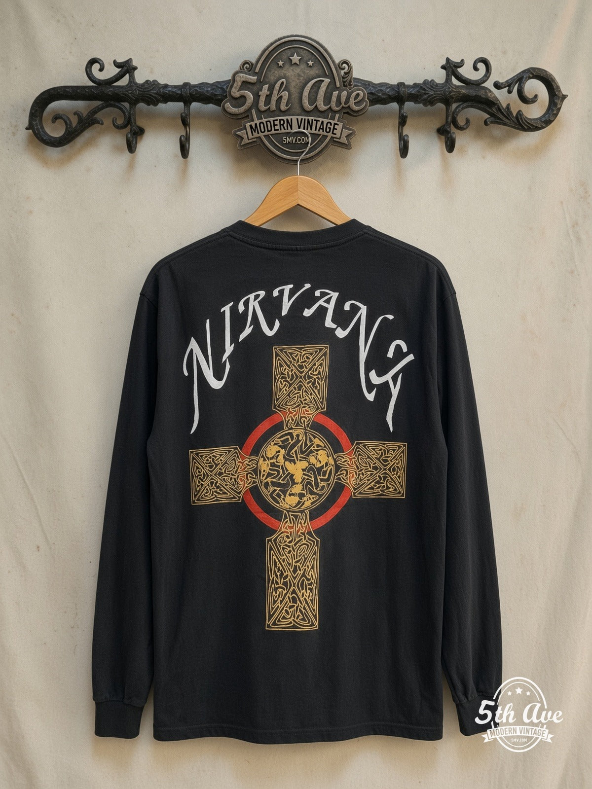 Nirvana – Pagan Cross 1991 – Vintage Band T-Shirt — back on locked cream ornate 5th Ave rack