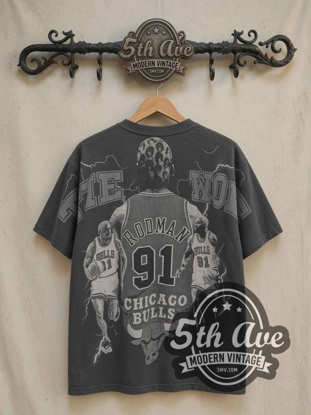 Dennis Rodman Chicago Bulls all-over-print graphic tee in black, back view on a display rack