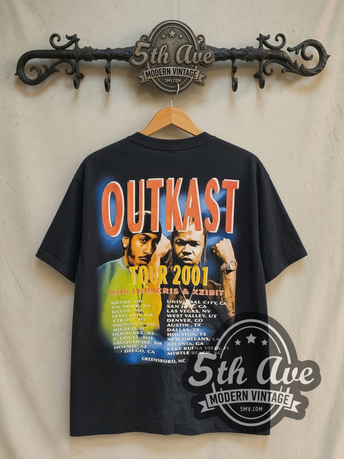 OutKast Stank Love Tour 2001 vintage rap tee in black, back view on a display rack