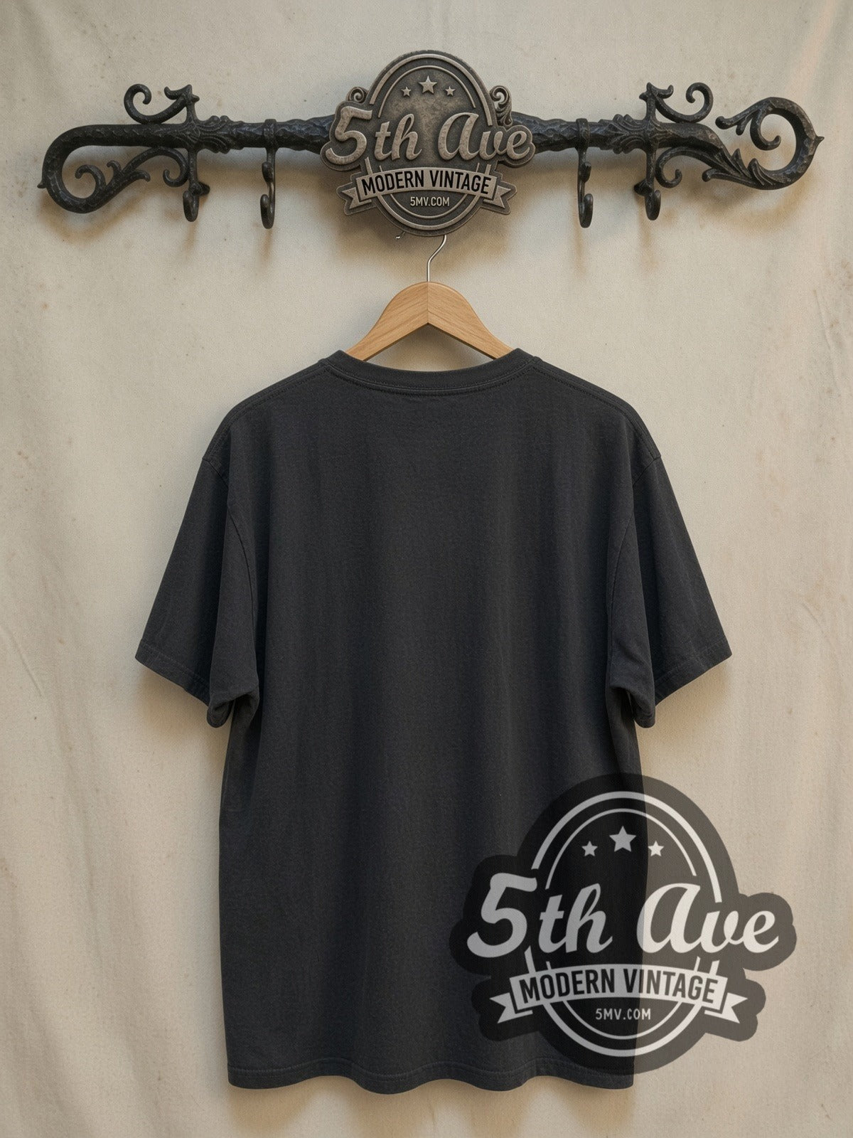 Thin Lizzy Stacked White Logo Guitarist Silhouette vintage band t-shirt, back view on a display rack
