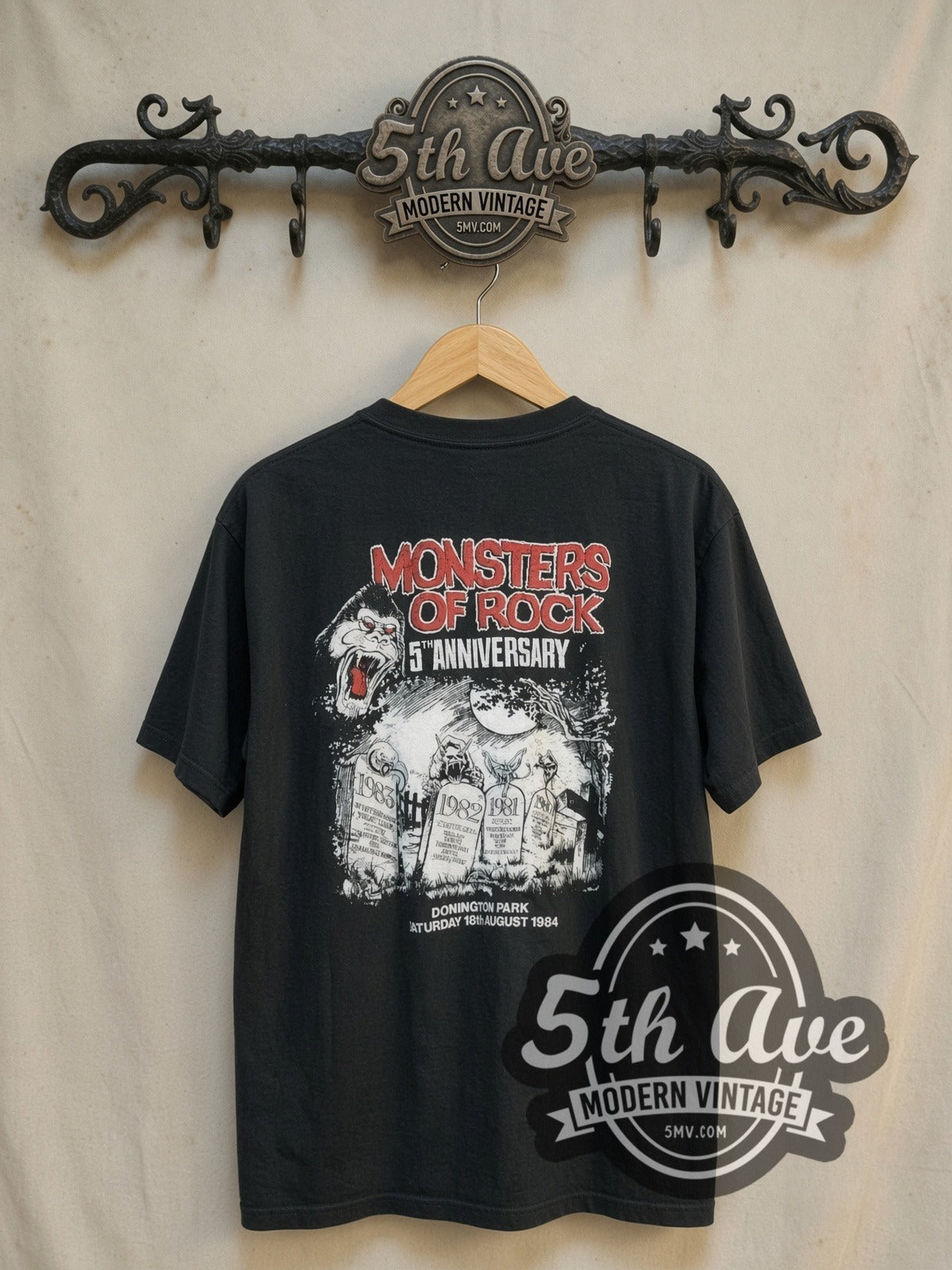 Mötley Crüe Monsters of Rock 1984 vintage band t-shirt, back view on a display rack