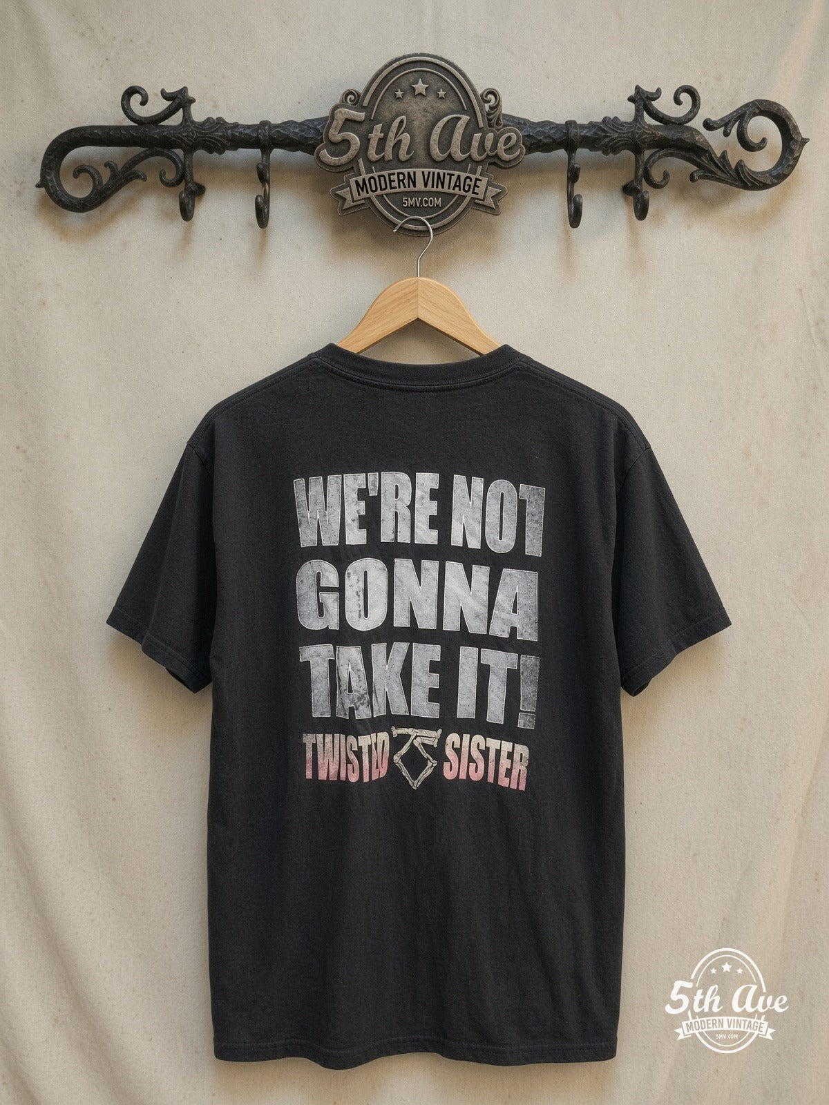 Twisted Sister – Bone TS Logo Pink Band Name – Vintage Band T-Shirt — back on locked cream ornate 5th Ave rack