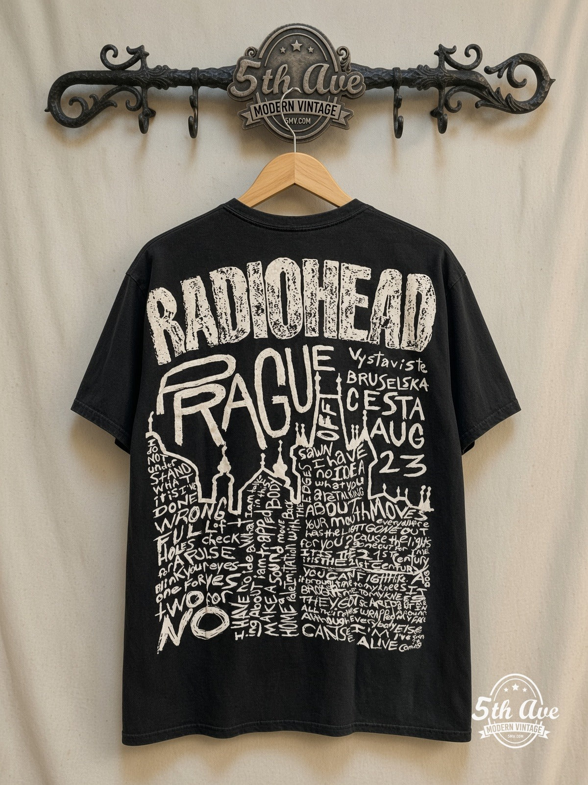 Radiohead – Prague – All Over Print – Vintage Band T-Shirt — back on locked cream ornate 5th Ave rack