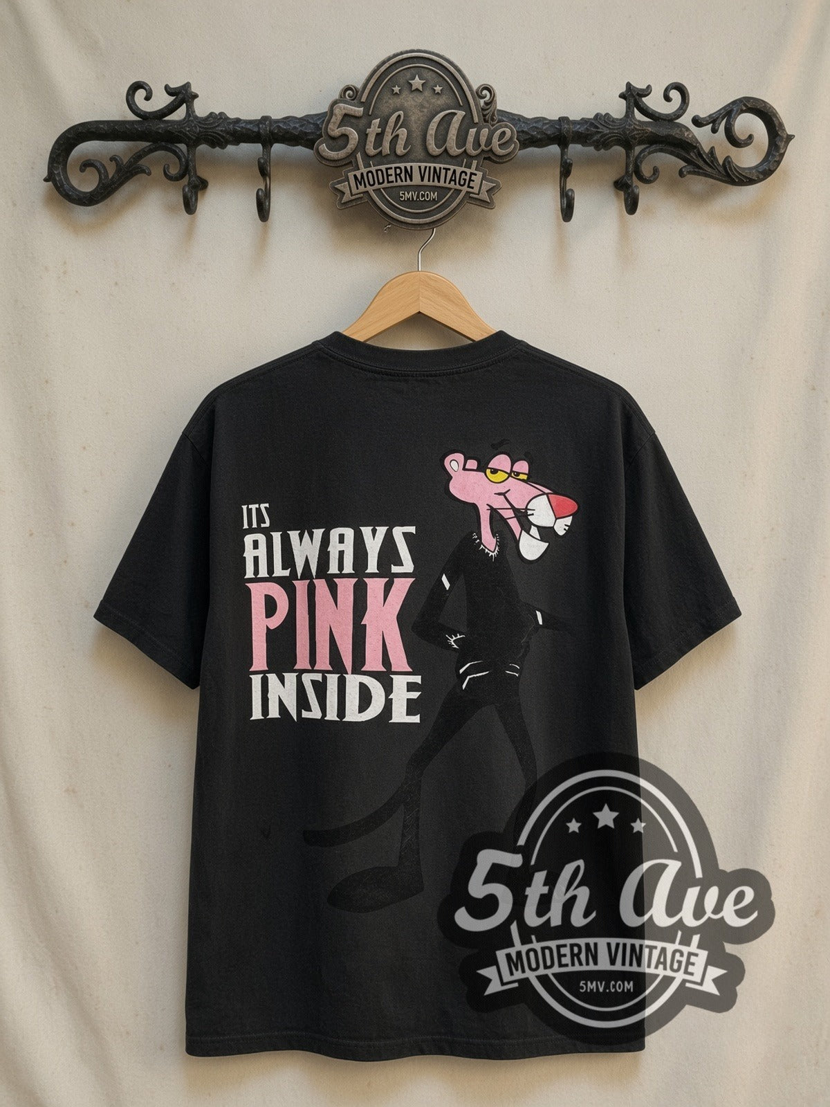 The Pink Panther Its Always Pink Inside vintage cartoon tee in black, back view on a display rack