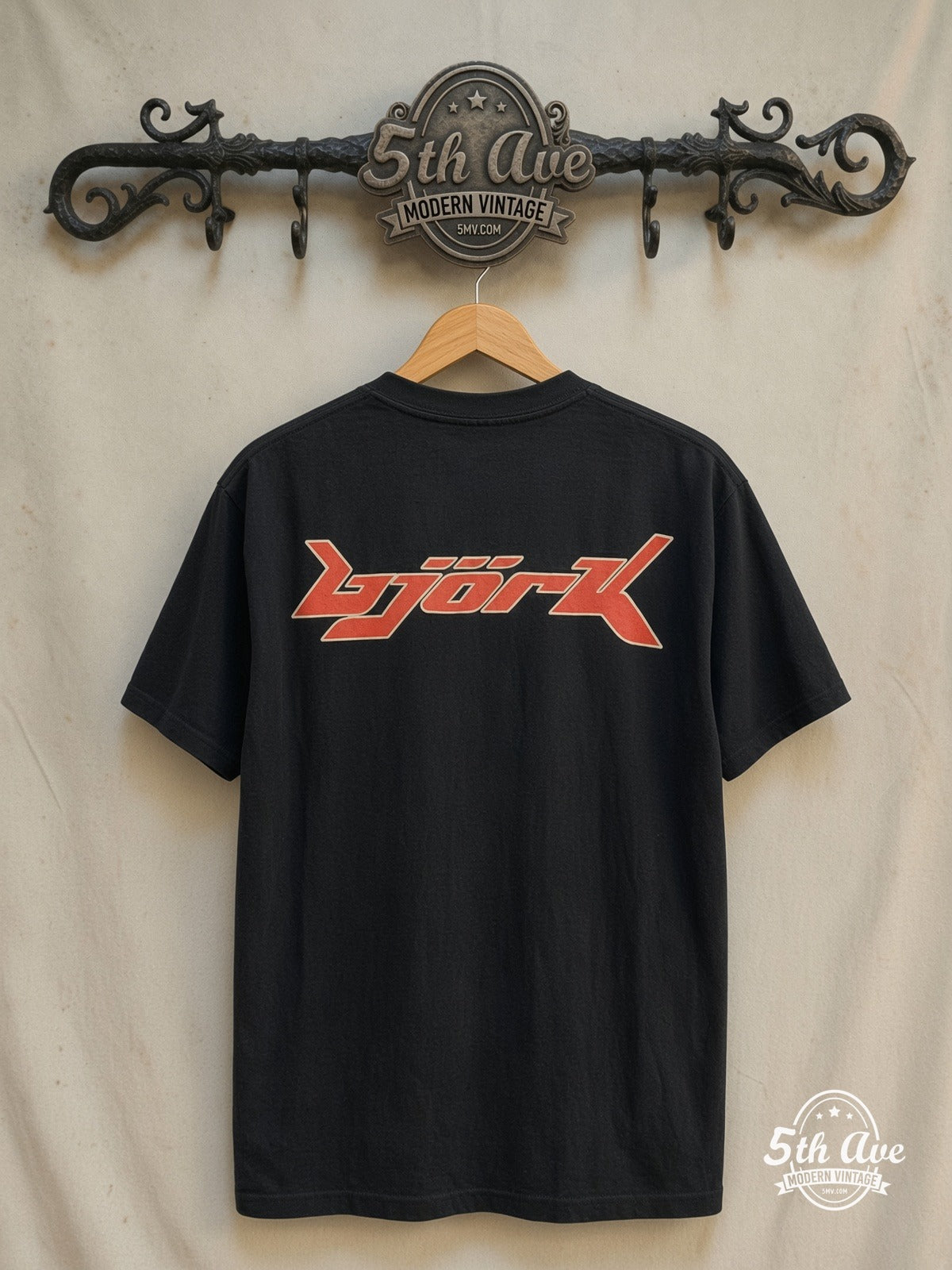 Björk – Isobel – Vintage Band T-Shirt — back on locked cream ornate 5th Ave rack