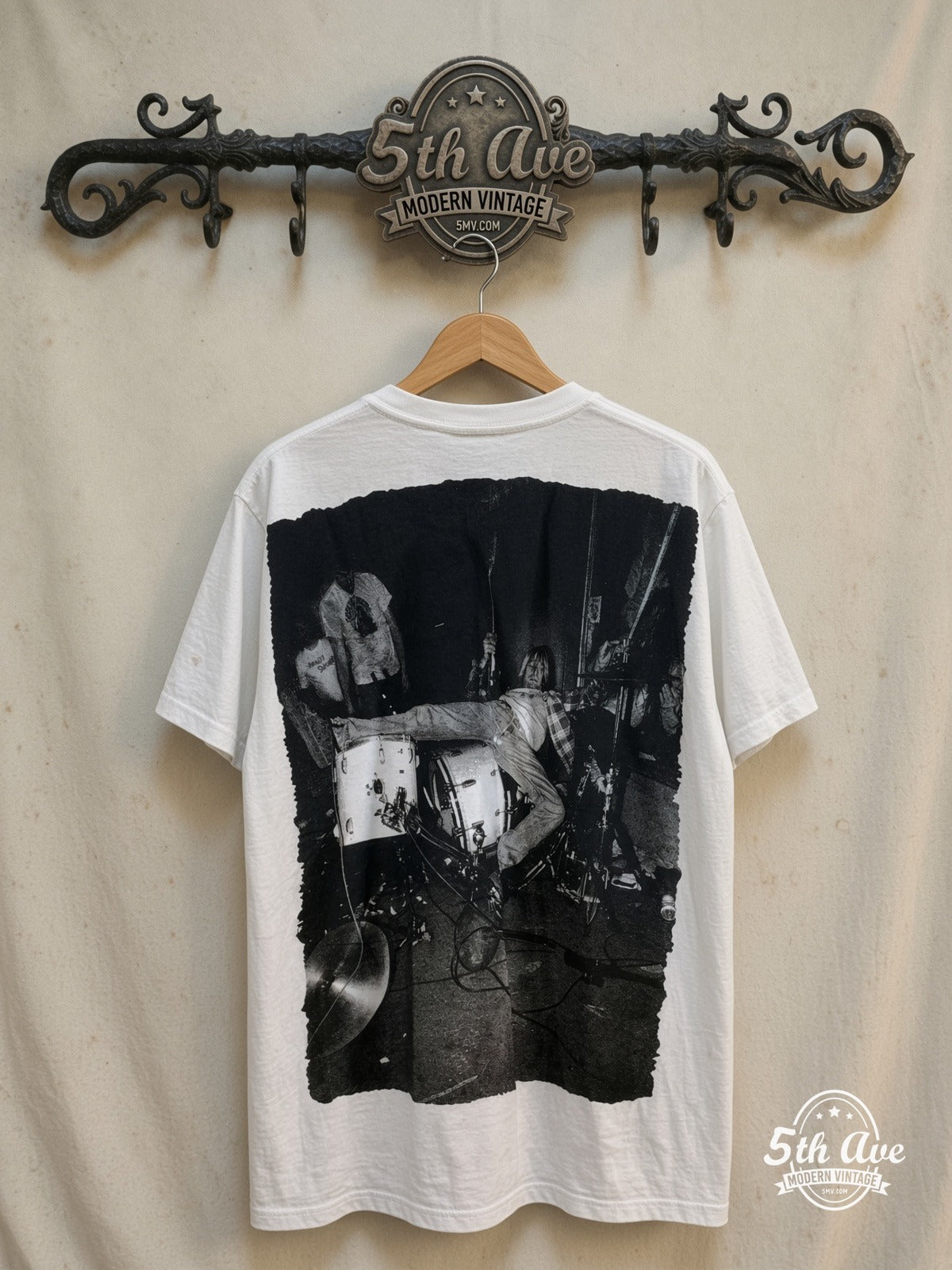 Nirvana – Kurt Cobain Tribute – All Over Print – Vintage Band T-Shirt — back on locked cream ornate 5th Ave rack