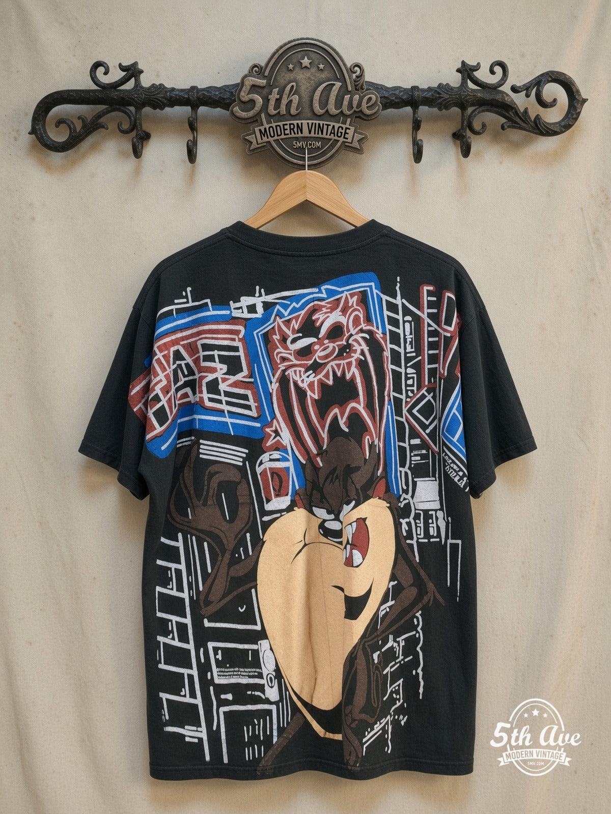 Looney Tunes – Taz-Mania Limited Edition – All Over Print – New Vintage Graphic Tee — back on locked cream ornate 5th Ave rack