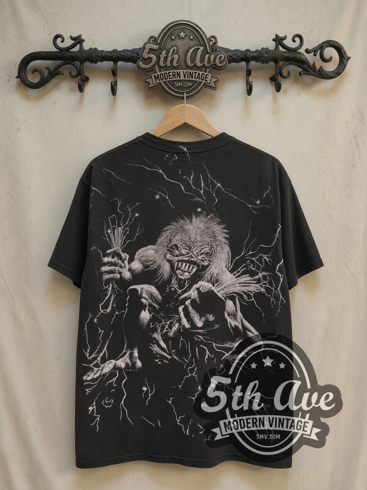 Iron Maiden Eddie Overprint vintage band t-shirt, back view on a display rack