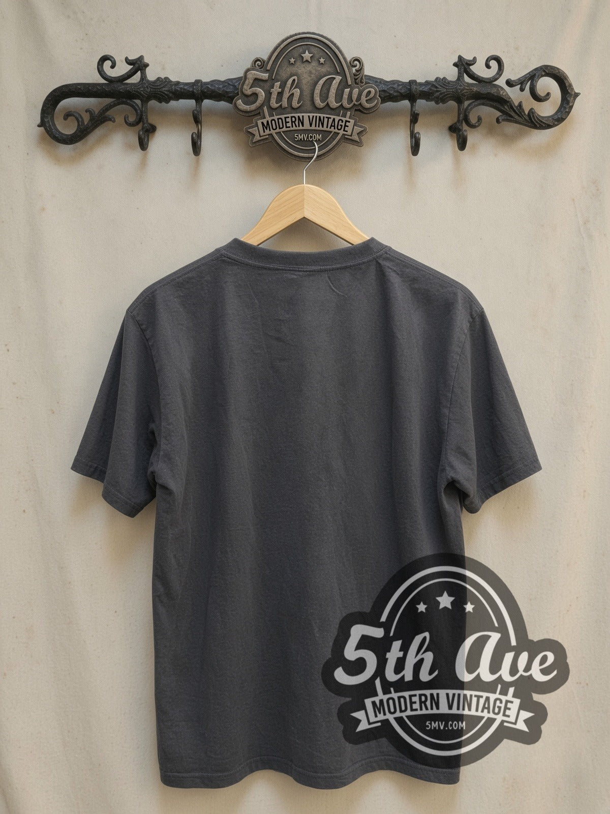 Mötley Crüe Autographed Members Group Photo vintage band t-shirt, back view on a display rack