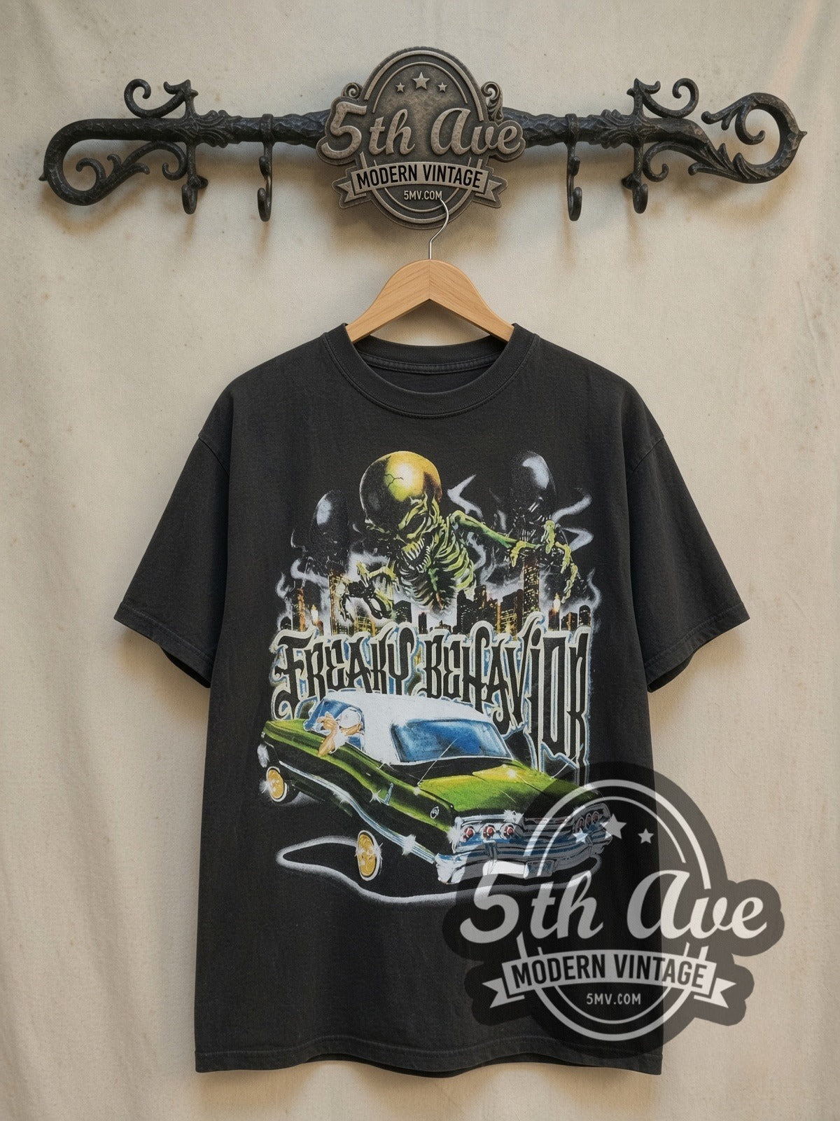 Rollin Hard Angel de la Guardia Lowrider vintage graphic tee, back view on a display rack