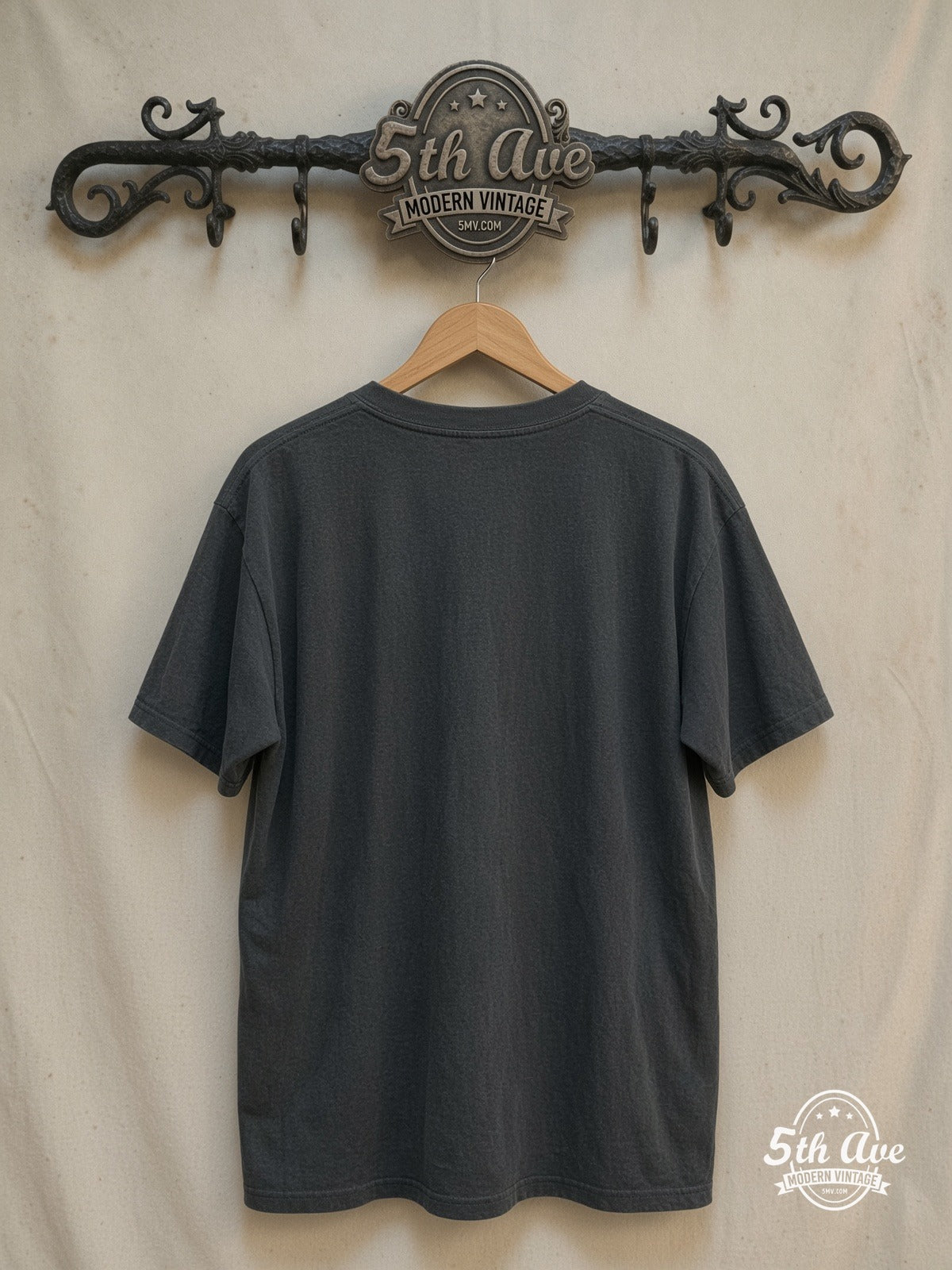 Queen – News of the World – Vintage Band T-Shirt — back on locked cream ornate 5th Ave rack