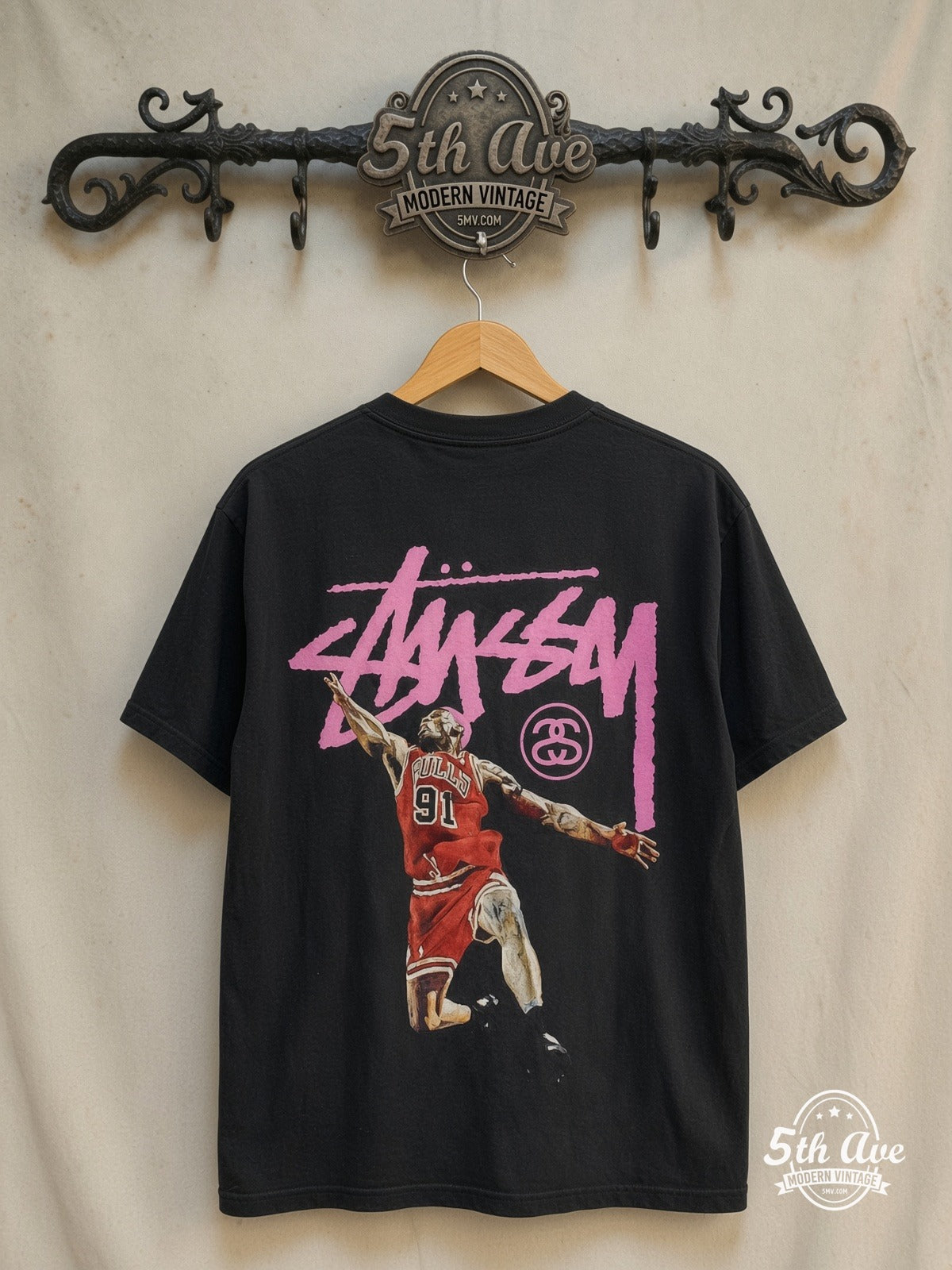 Dennis Rodman x Stüssy – The King of Rebound – Vintage Graphic Tee — back on locked cream ornate 5th Ave rack