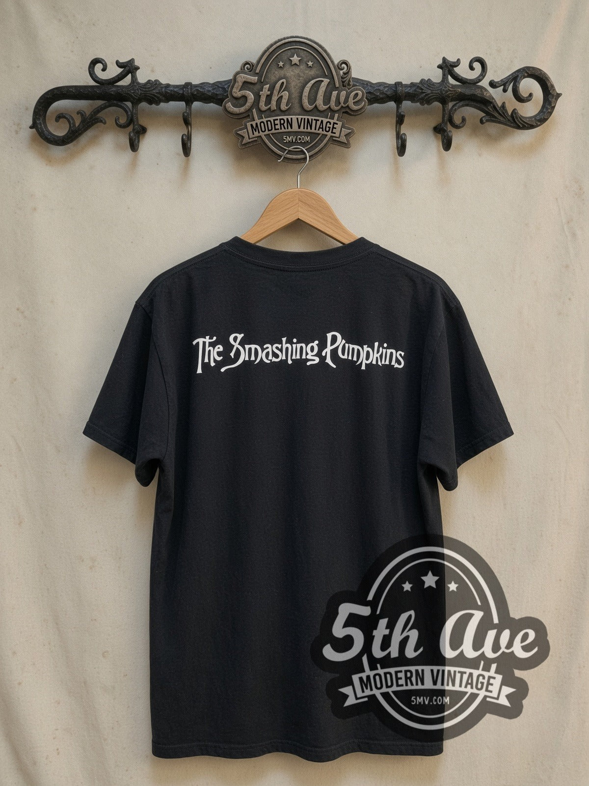 The Smashing Pumpkins Mellon Collie and the Infinite Sadness vintage band t-shirt, back view on a display rack